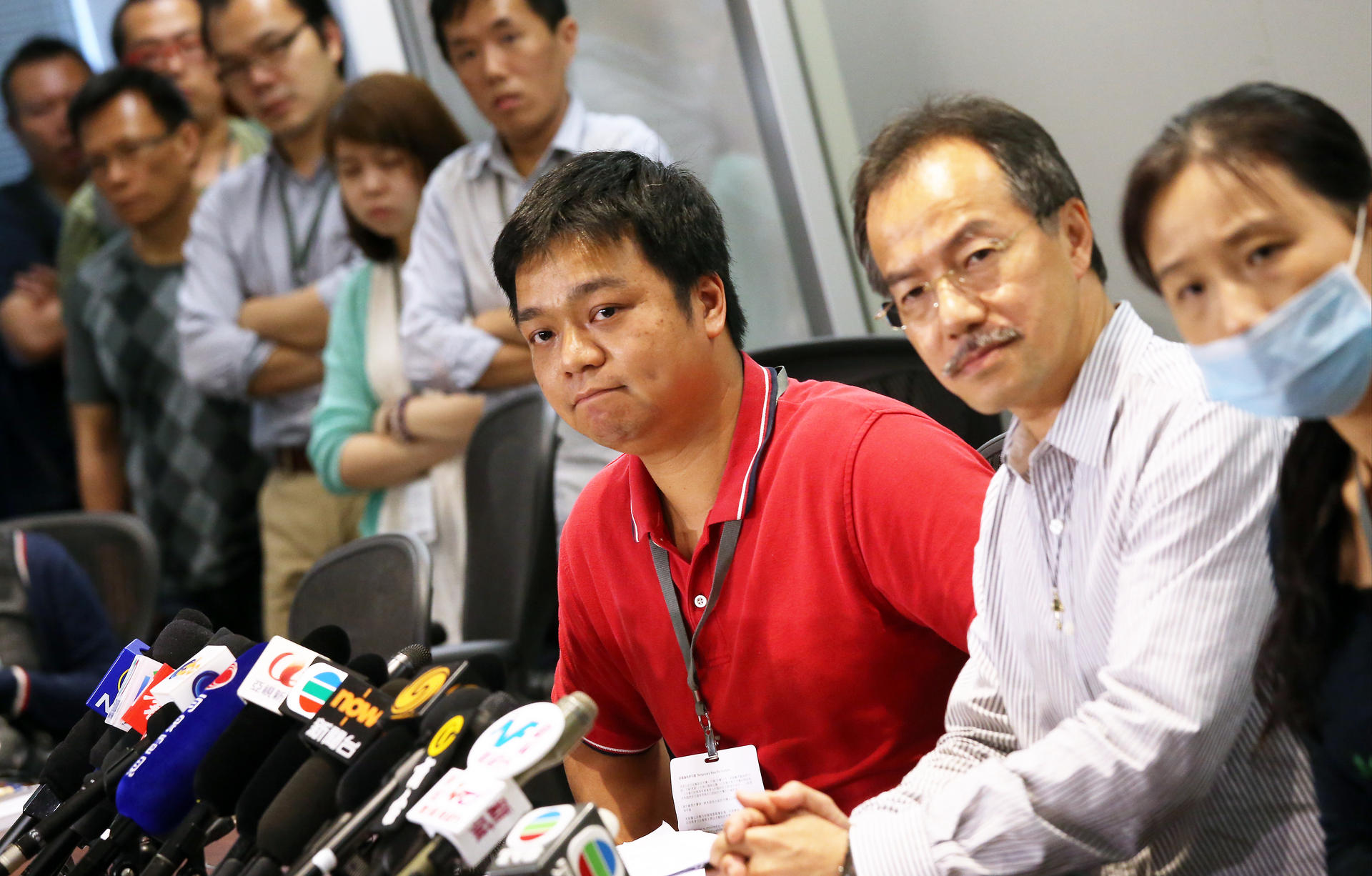 Au Wai-ho (left), brother of the wrongfully arrested autistic man, says the family will file a complaint despite police regret. Photo: K. Y. Cheng