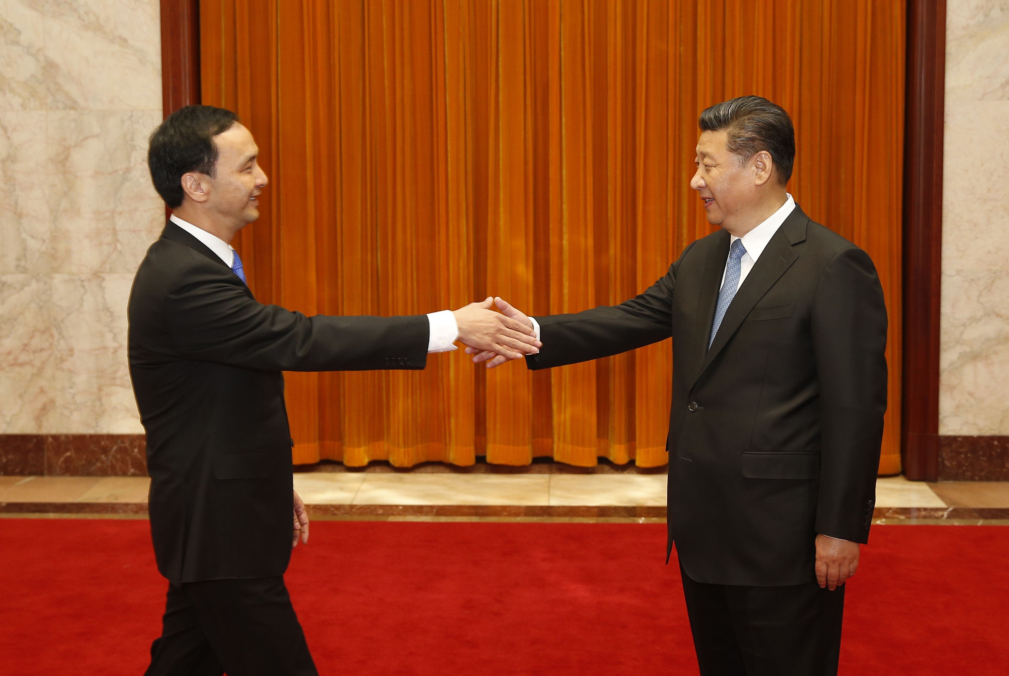 During Xi's meeting with KMT chairman Eric Chu (left), Xi proposed five guidelines for strengthening ties that clearly reflected Beijing's strategic thinking. Photo: AFP