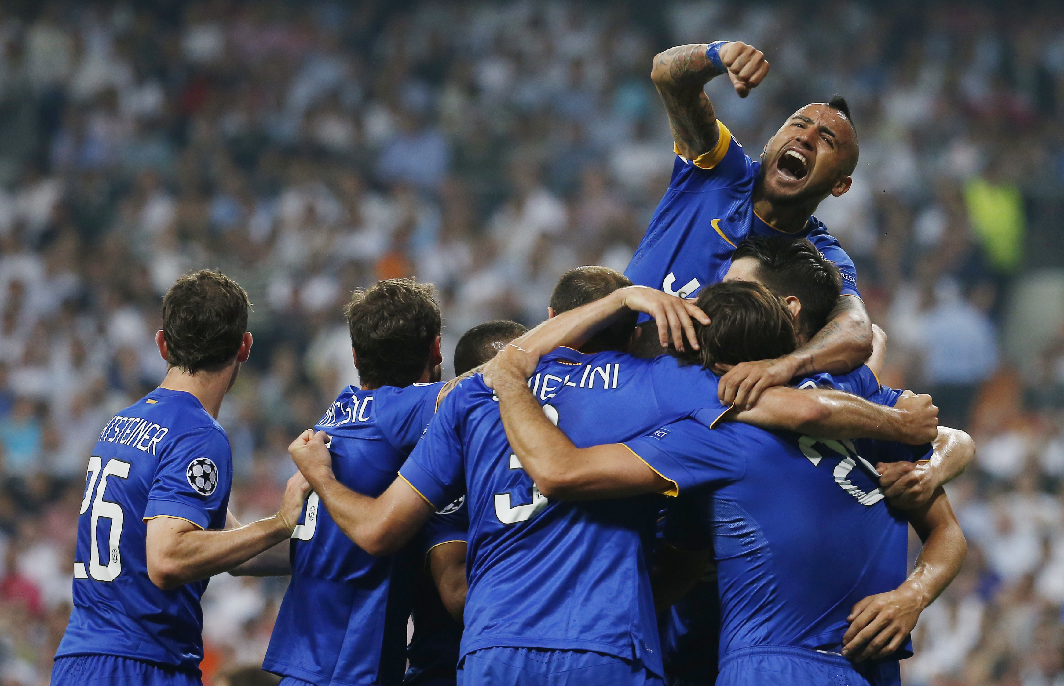 Juventus' Alvaro Morata celebrates scoring with Arturo Vidal and team mates. Photo:  Reuters