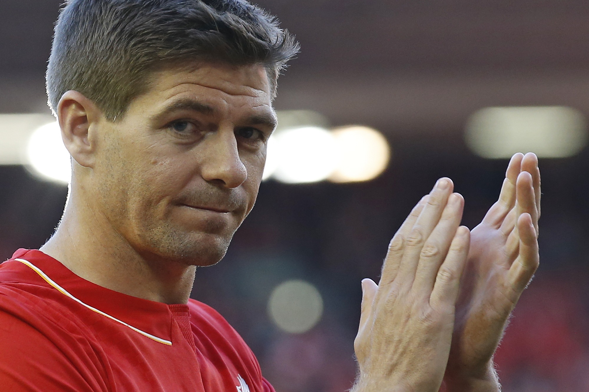 Steven Gerrard acknowledges the fans. Photo: AP