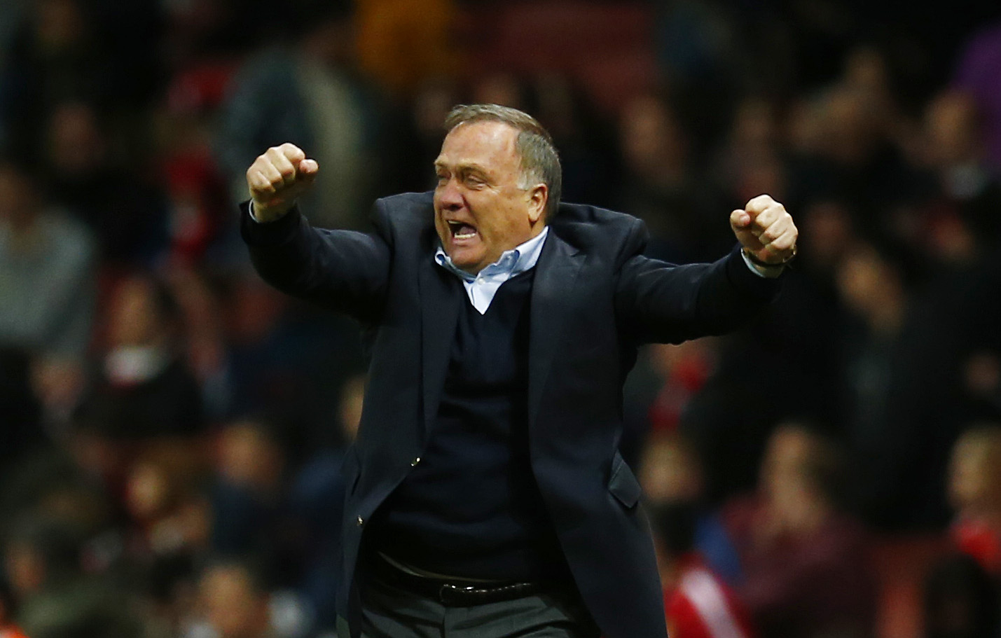 Sunderland manager Dick Advocaat celebrates a 0-0 draw at Arsenal - and avoiding relegation. Photo: Reuters