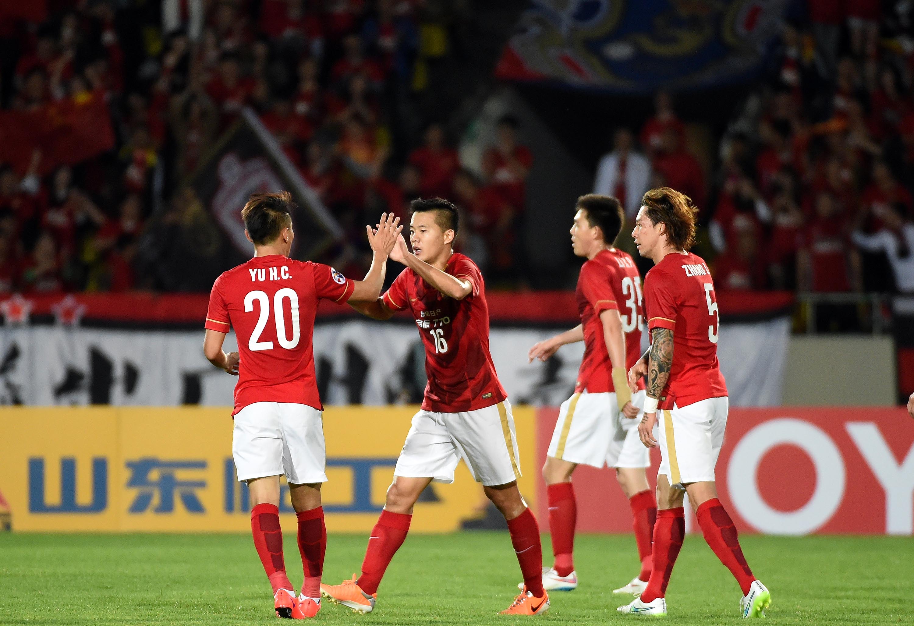 Guangzhou Evergrande's Huang Bowen celebrates his goal with teammates during their AFC Champions League round-of-16 first-leg tie. Photo: Xinhua