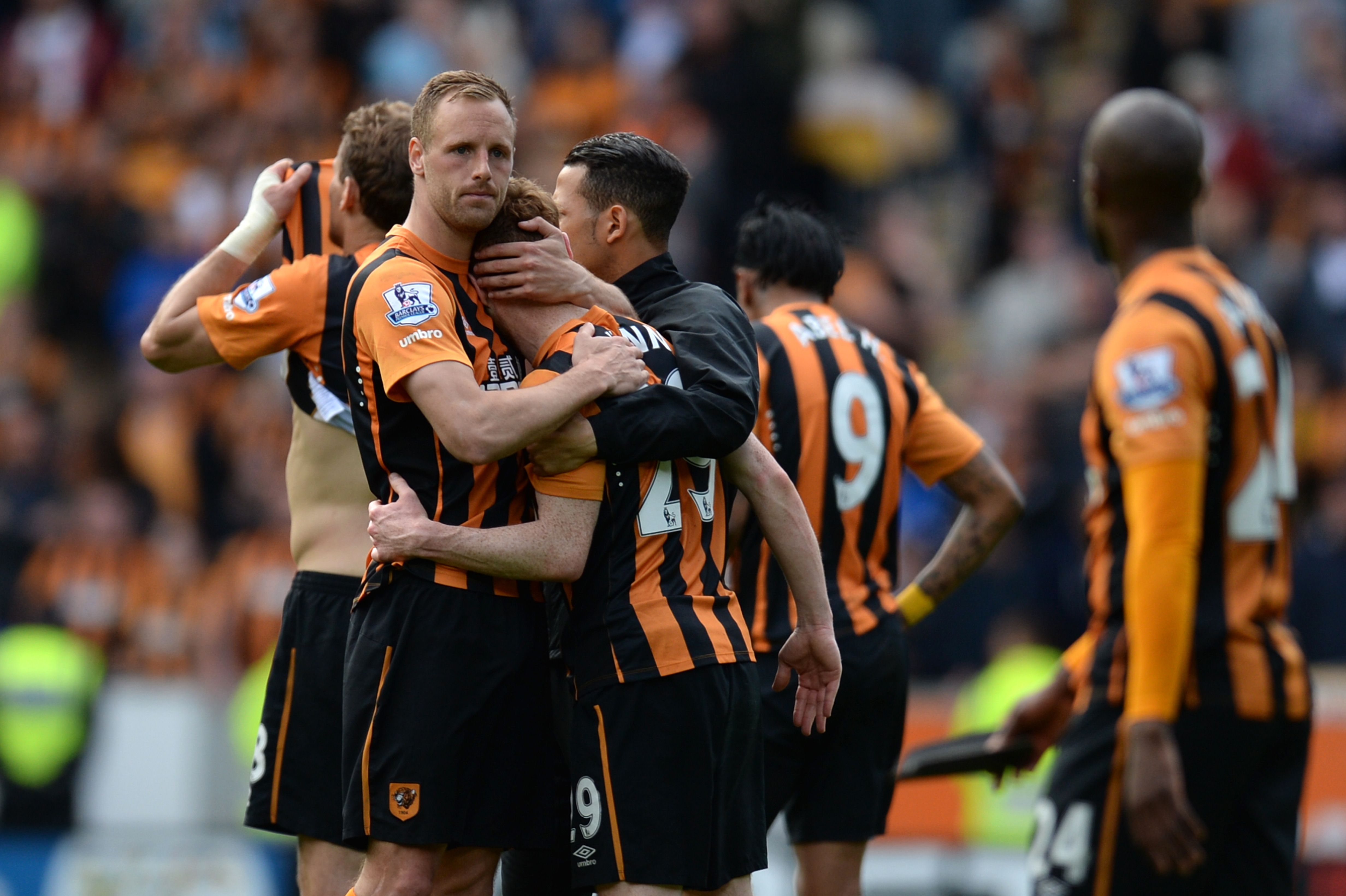 Hull City midfielder David Meyler tries to console Stephen Quinn at the final whistle with the realisation they are going down. Photo: AFP