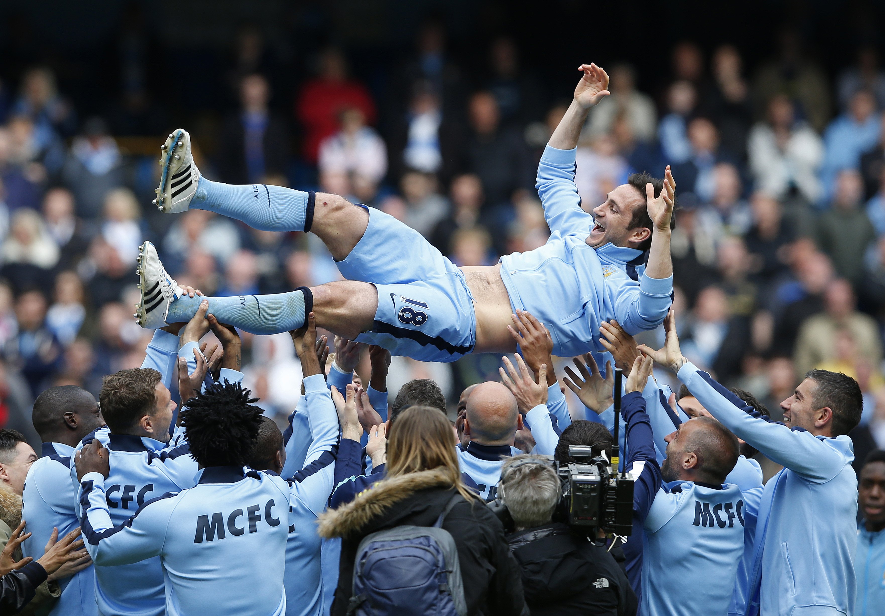 Manchester City's Frank Lampard is thrown in the air by teammates after the 2-0 victory over Southampton.  Photo: Reuters