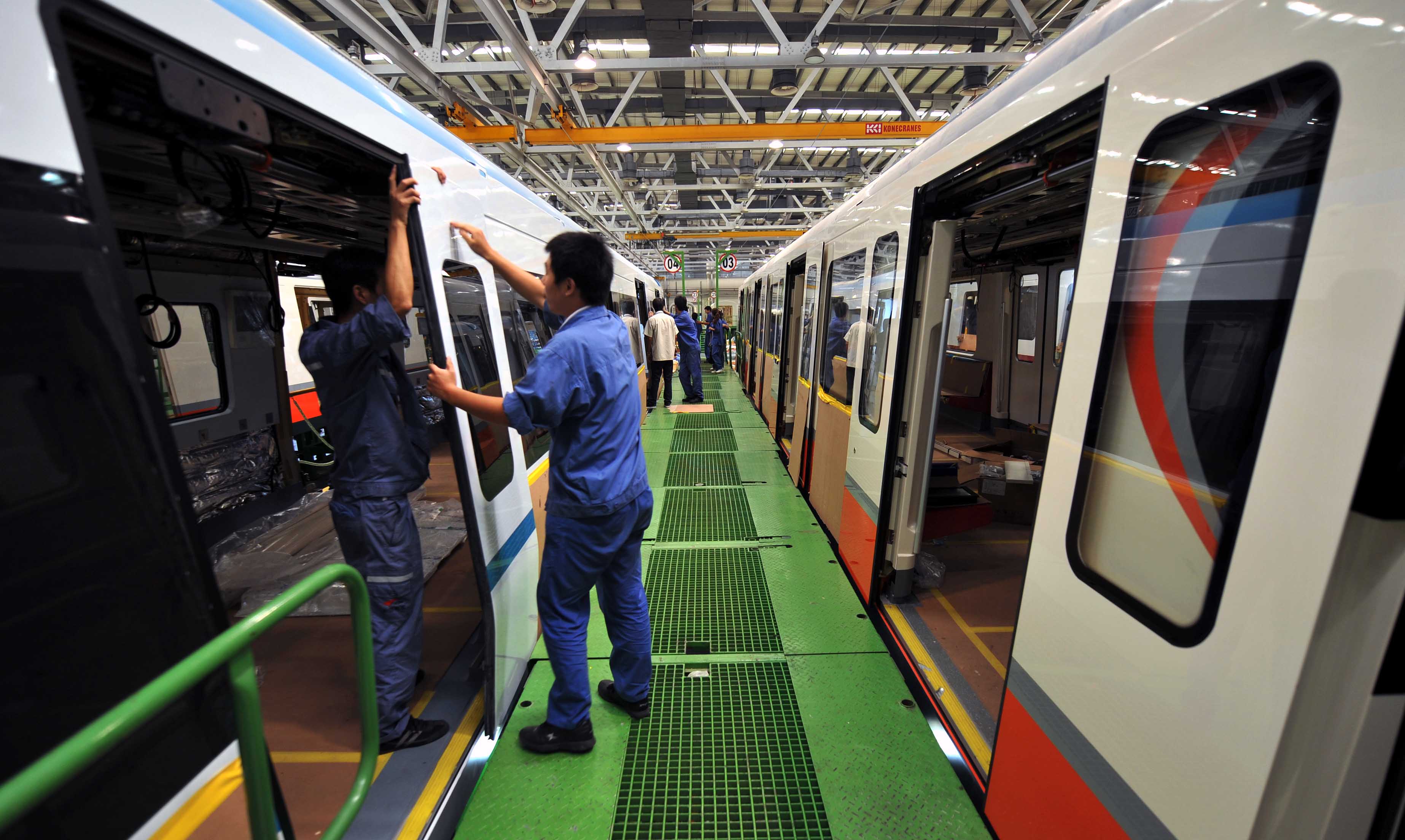 China's plan to boost manufacturing should help the stocks of companies like those who build parts for railway and subway cars. Photo: Xinhua