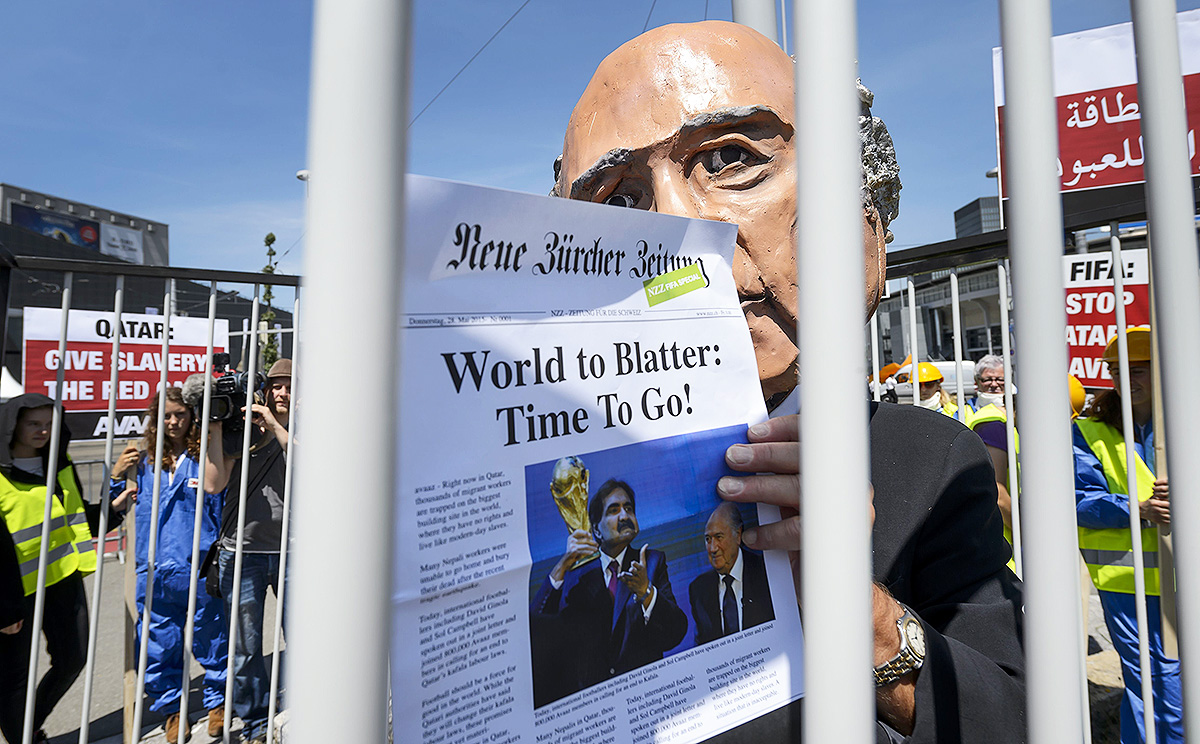 A demonstrator disguised as Fifa President Sepp Blatter takes part in a protest against the condition of workers in Qatar in Zurich. Photo: AFP