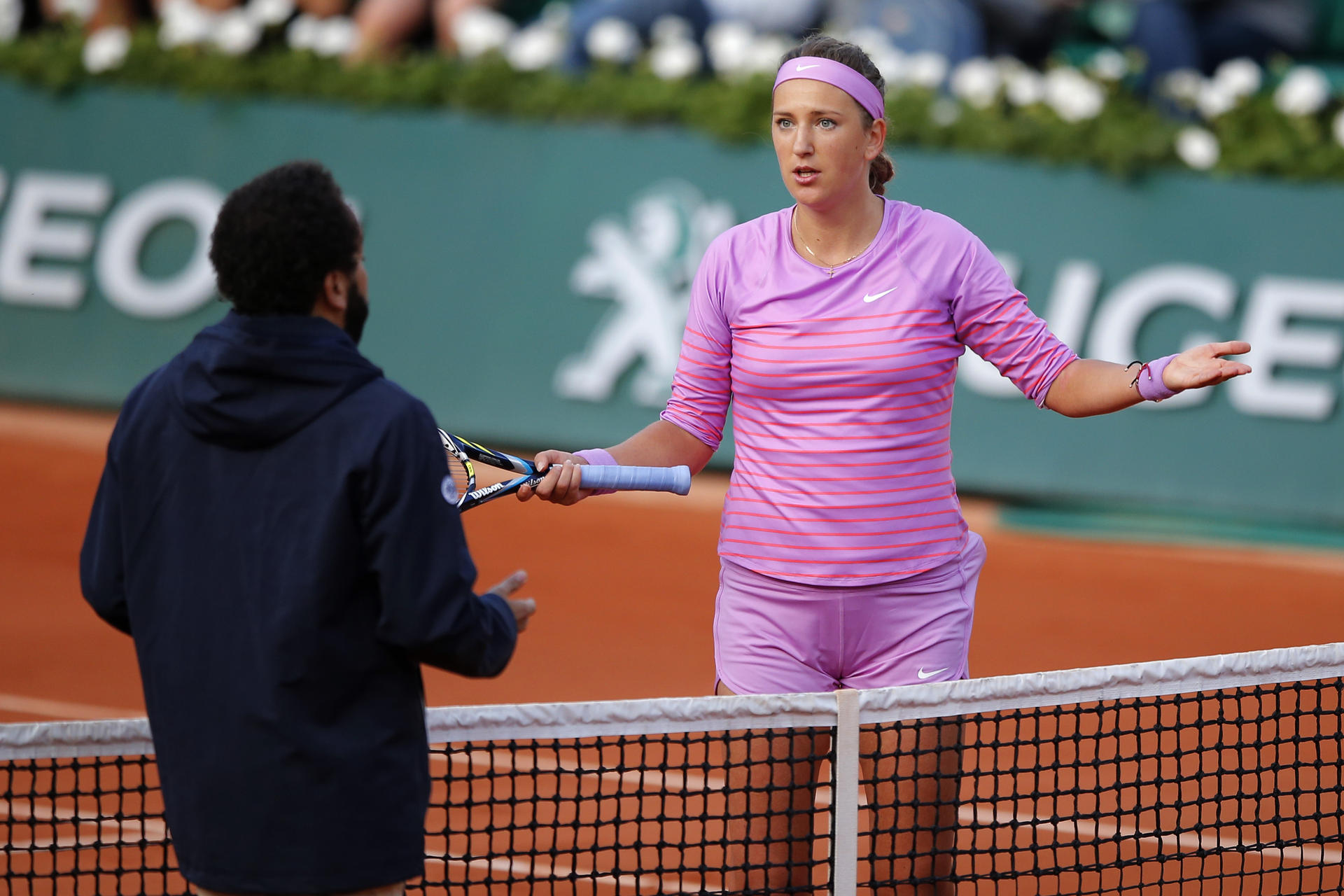 Victoria Azarenka argues with chair umpire Kader Nouni. Photo: AP