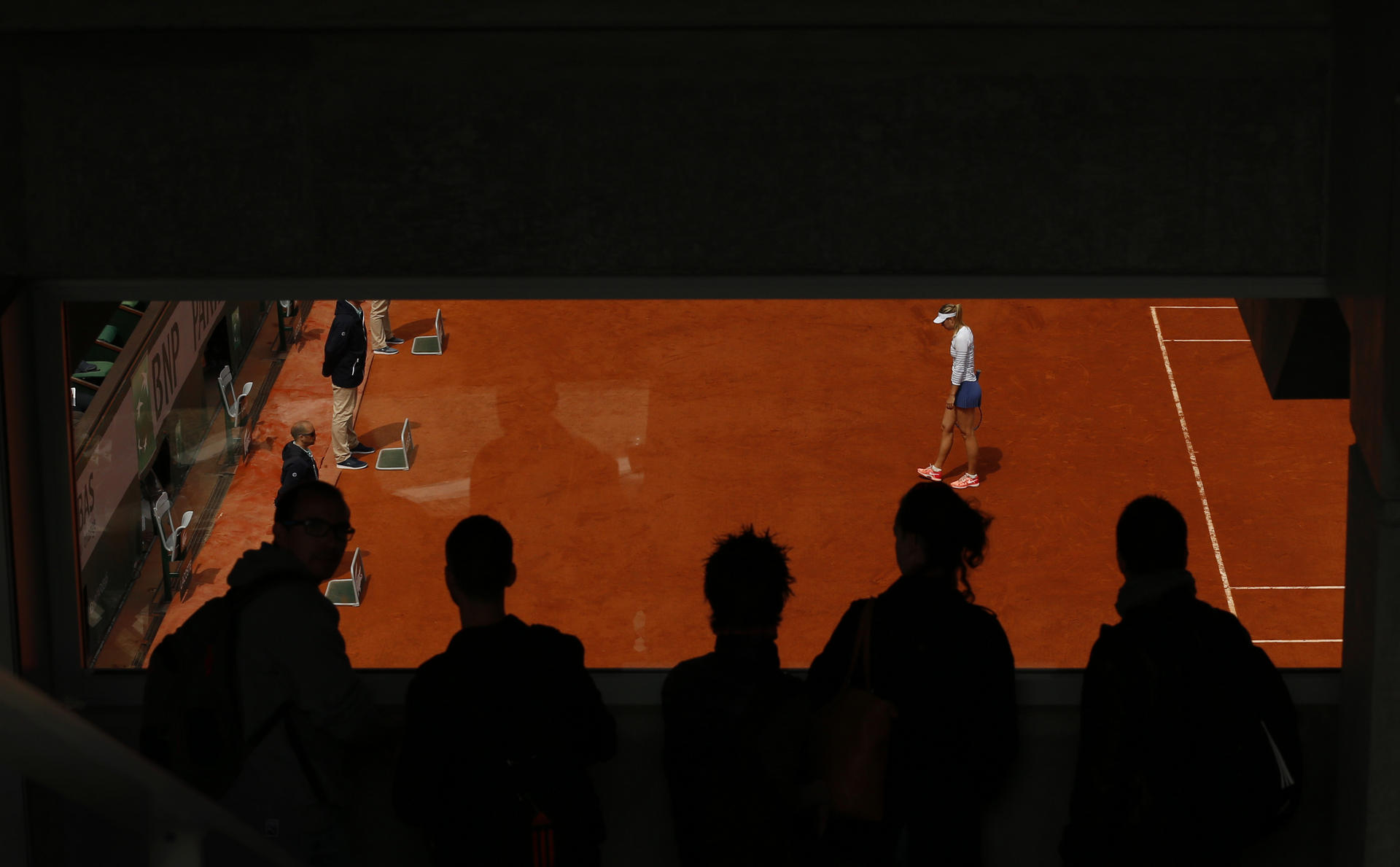 Maria Sharapova cuts a lonely figure in a fourth-round match she lost against Lucie Safarova at the French Open. Photo: Reuters