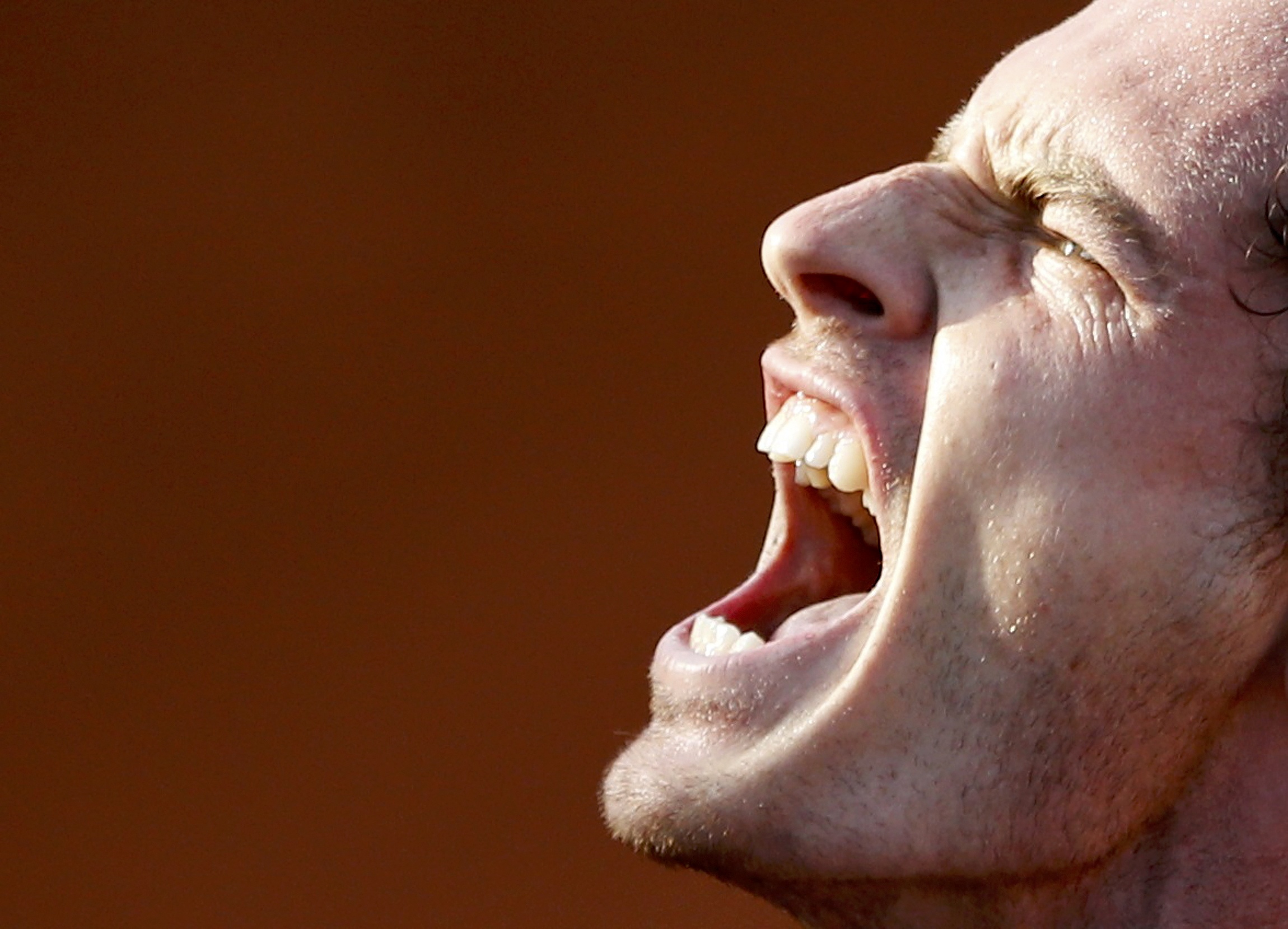 Andy Murray lets it all out during his four-set victory over David Ferrer in the quarter-finals at Roland Garros. Photo: Reuters