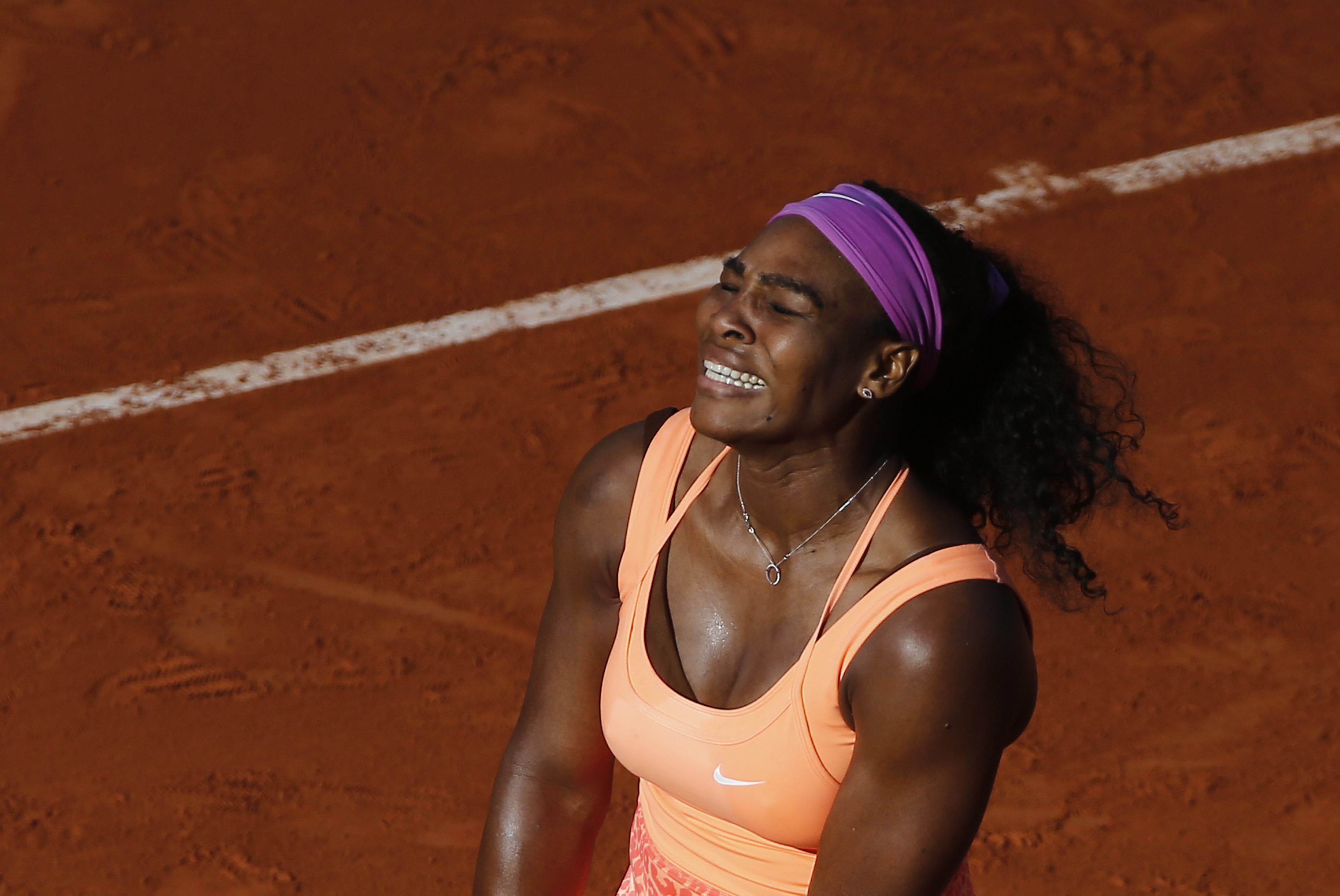 Serena Williams feels the pain in her semi-final against Timea Bacsinszky. Photo: EPA