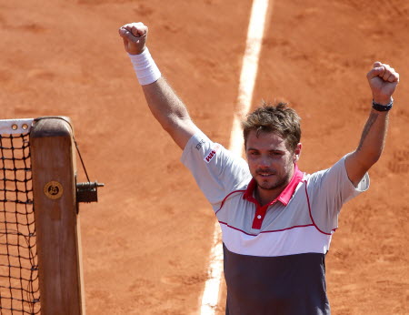 Stan Wawrinka raises his arms in triumph after beating Jo-Wilfried Tsonga in the French Open semi-finals. Photos: EPA