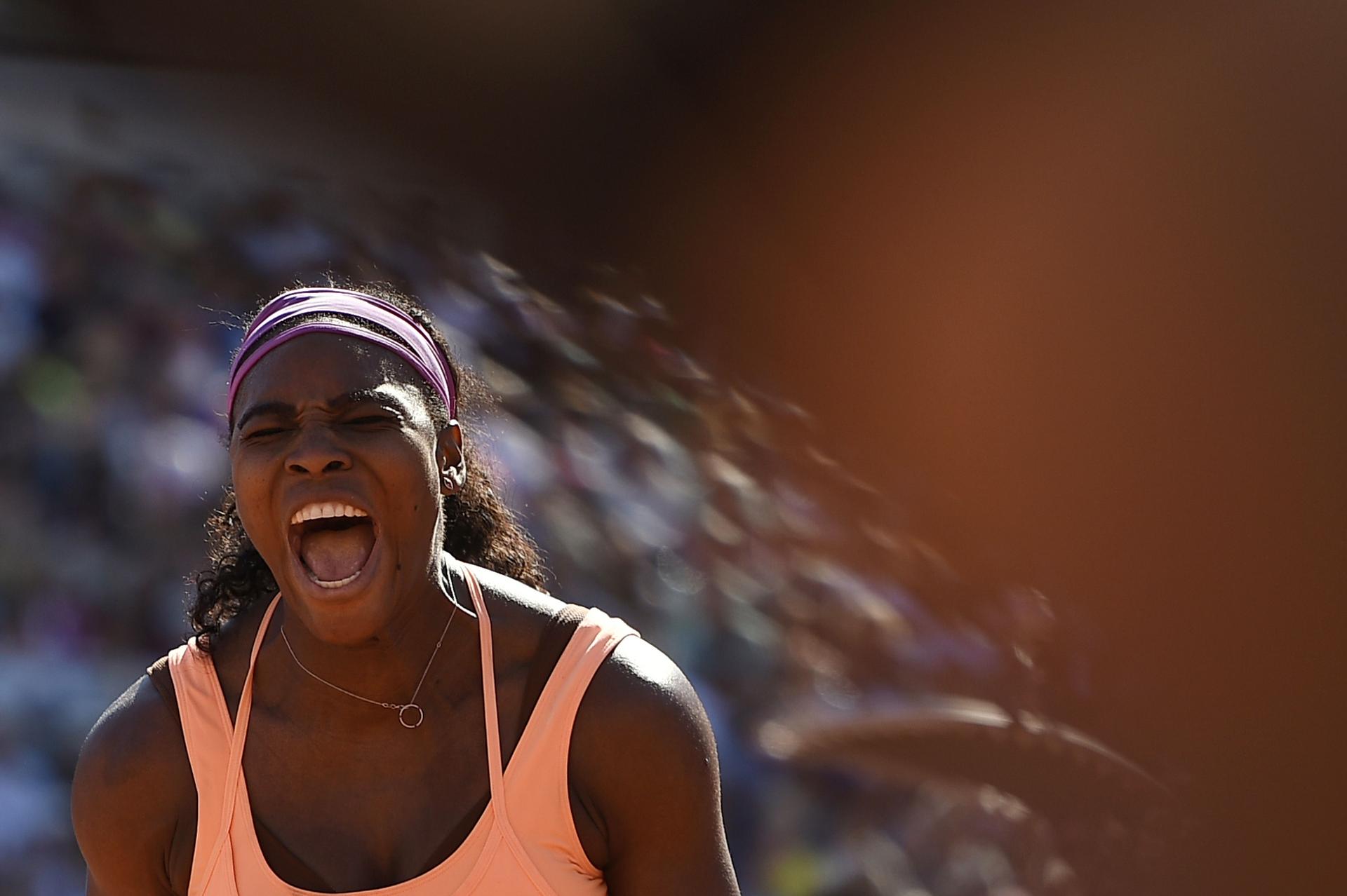 Serena Williams screams in delight after winning the French Open women's singles final at Roland Garros. Photo: AFP