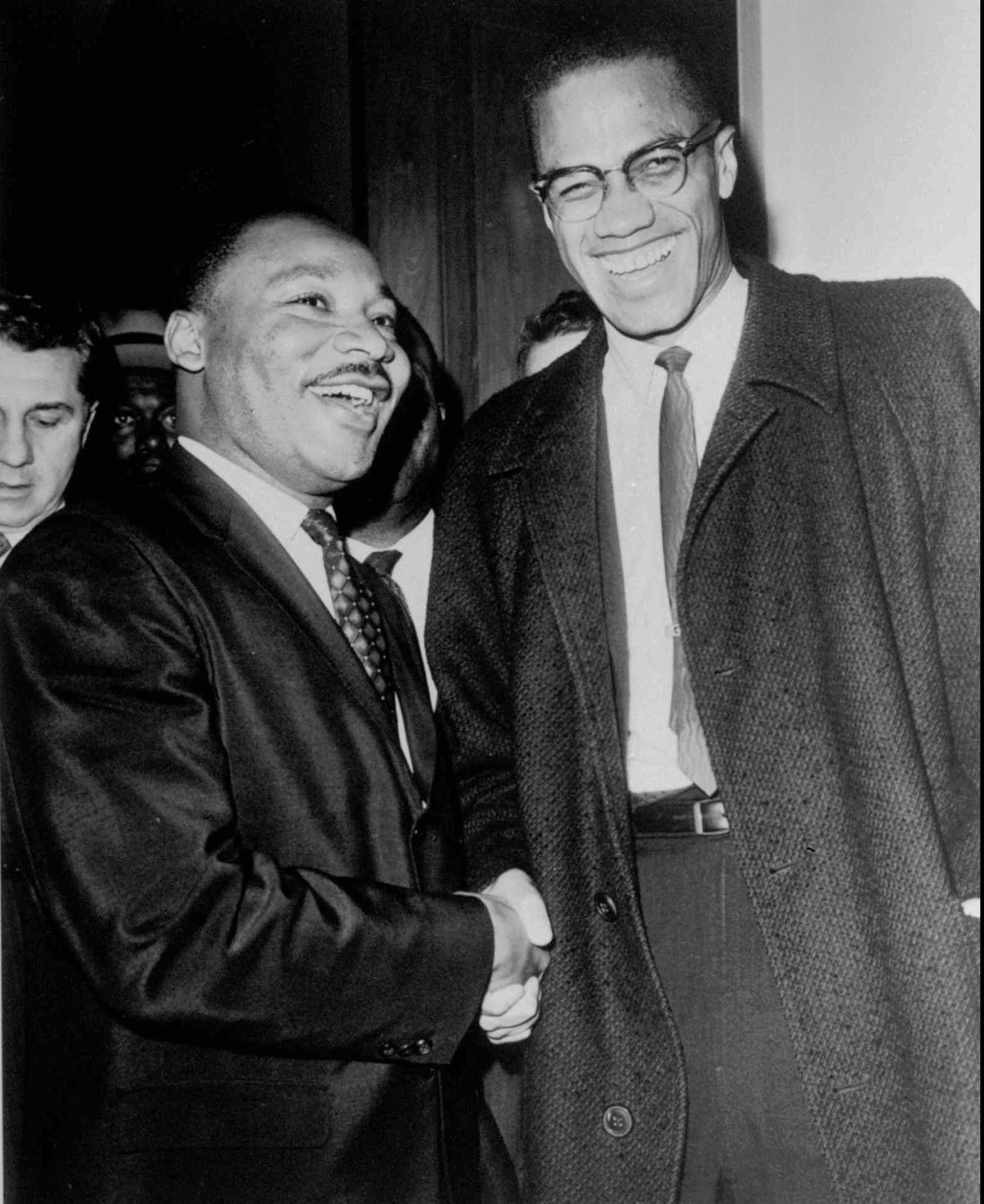 The Rev. Martin Luther King Jr., left, of the Southern Christian Leadership Conference, and fellow civil rights leader Malcolm X, heading a new group known as Muslim Mosque, smile for photographers in 1964. Photo: AP