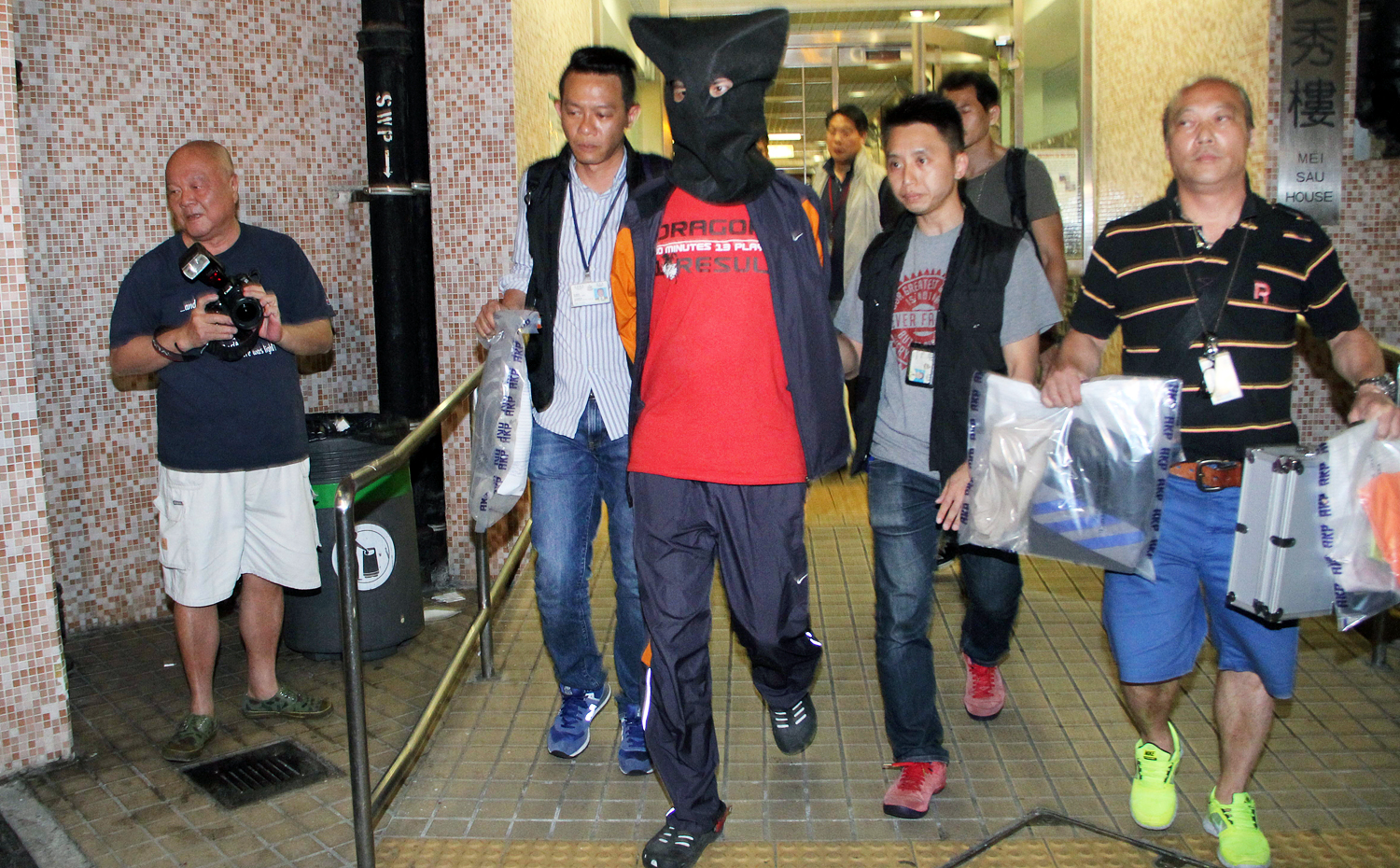 Police detain the autistic man. Photo: SCMP Pictures