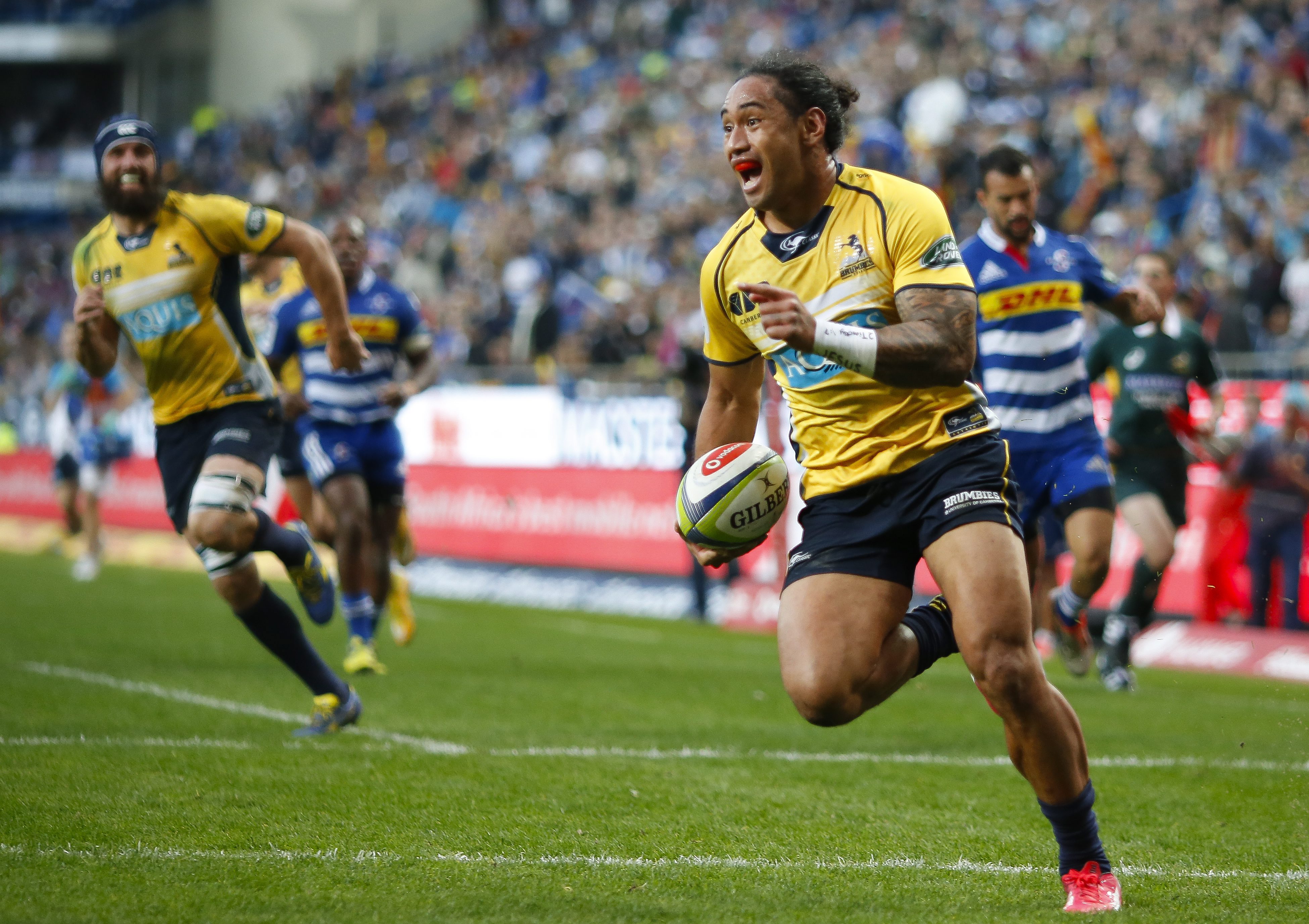 Joe Tomane breaks clear on his way to scoring his third try for the Brumbies in their 39-19 win over the Stormers in Cape Town. Photos: EPA