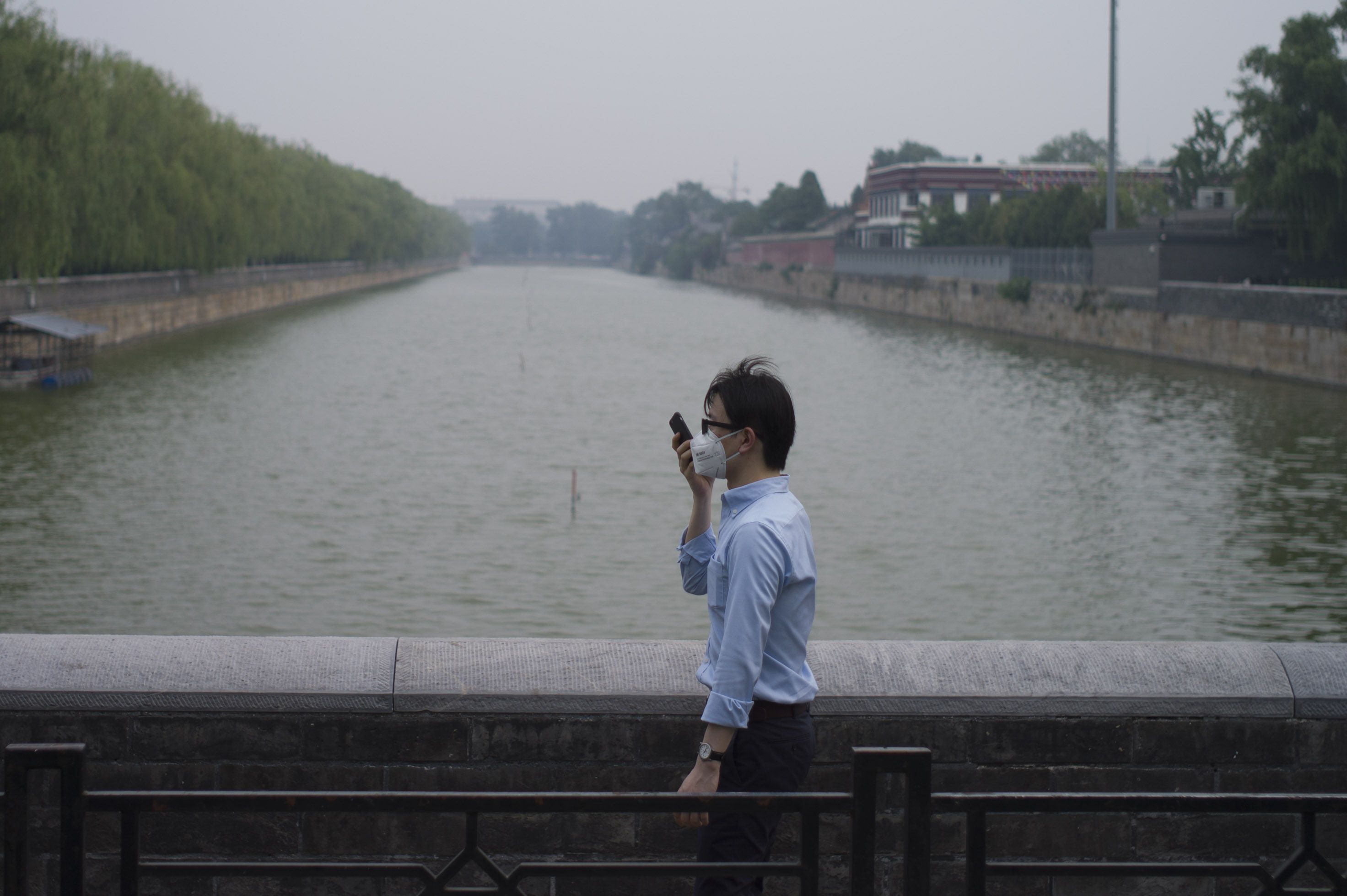 Another smoggy day in Beijing. Scientists and students should be funded to design affordable air filters and user-friendly masks. Photo: AFP