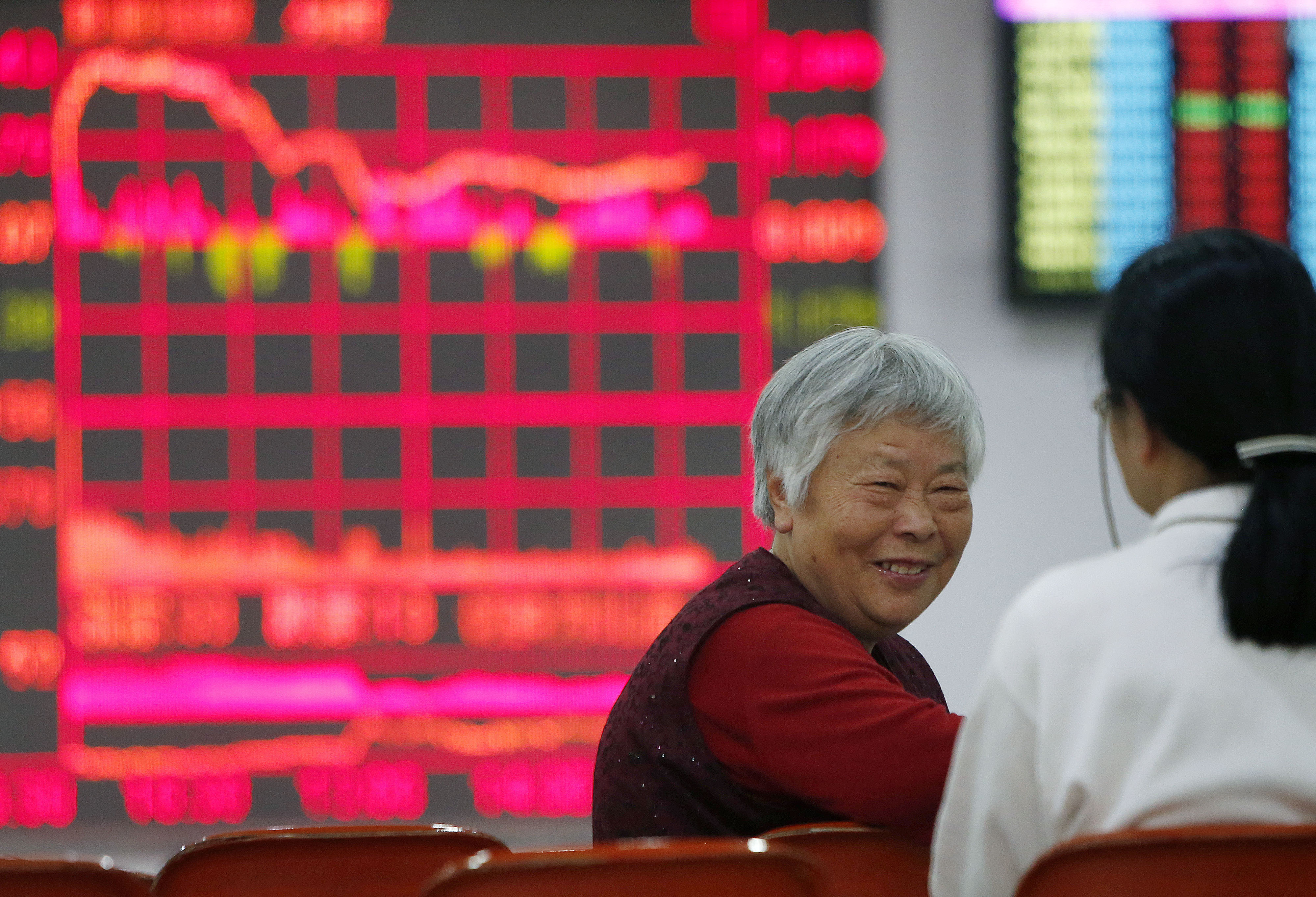 Investors watch the performance of stocks in China as the country's pension fund said it would pump up to 30 per cent of its net assets into equity investments. Photo: Xinhua