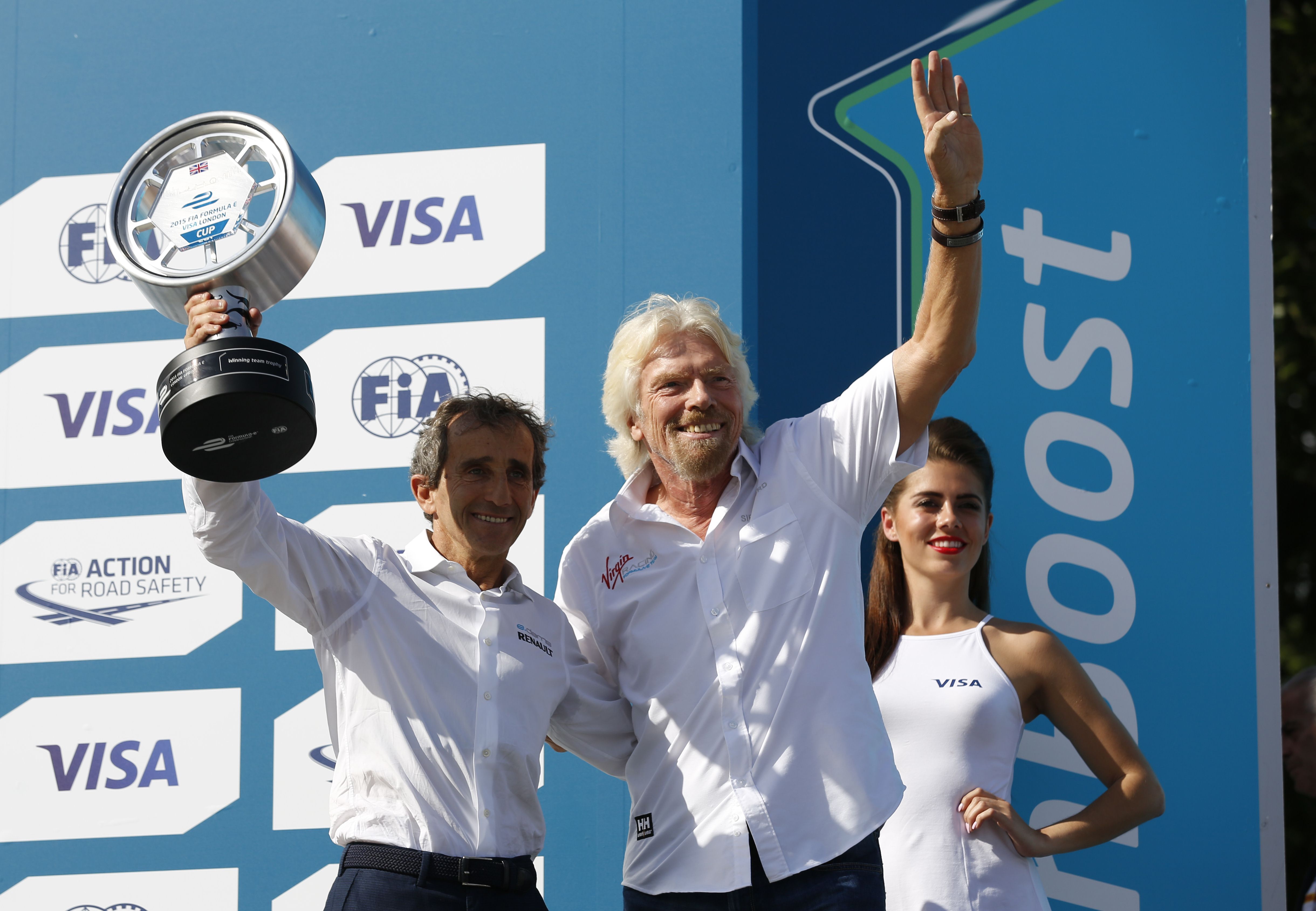 Richard Branson after presenting former French Formula One driver Alain Prost with the team trophy after the finale of the Formula E series in London. Photo: AFP