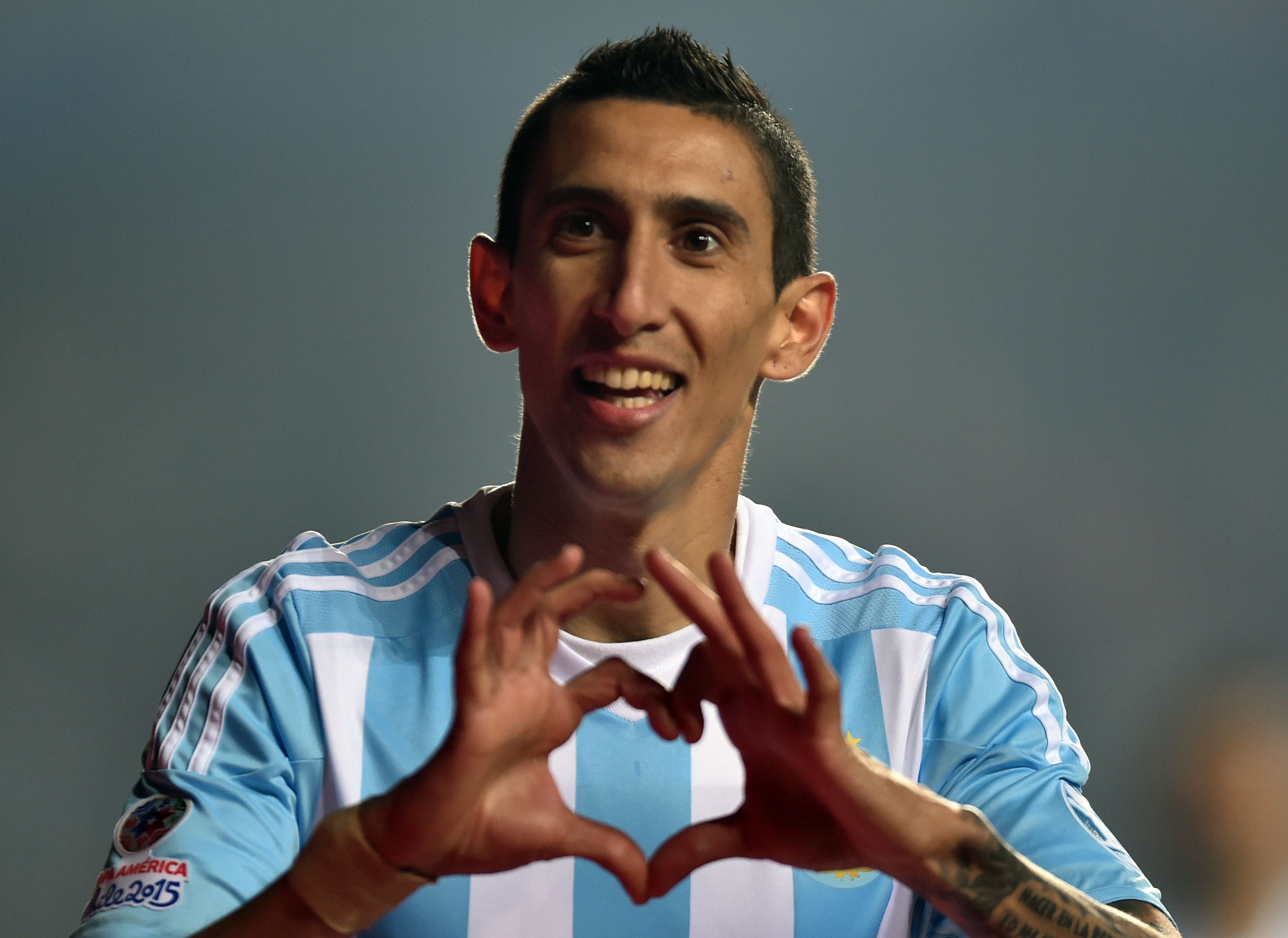 Angel di Maria celebrates one of his two goals against Chile. Photo: AFP