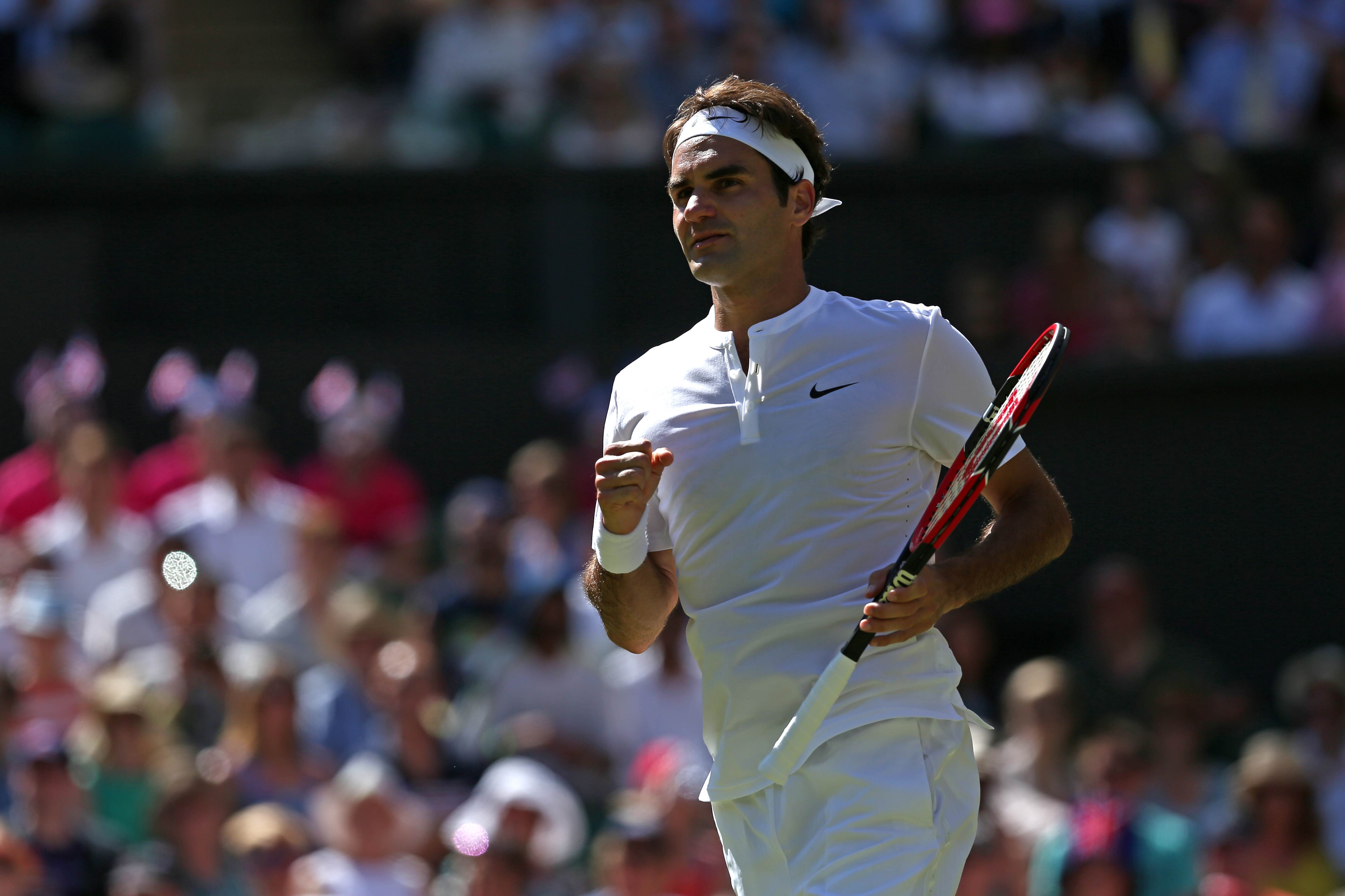 Roger Federer celebrates reaching the last 16 at Wimbledon after defeating Australia's Sam Groth. Photo: AFP