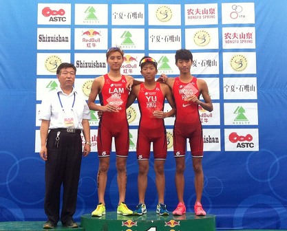 Hong Kong's Mark Yu is flanked by teammates Michael Lam (left) and Wong Tsz-to on the podium after their clean sweep of the elite junior race at the Shizuishan ASTC Triathlon Premium Asian Cup event. Photo: SCMP Pictures
