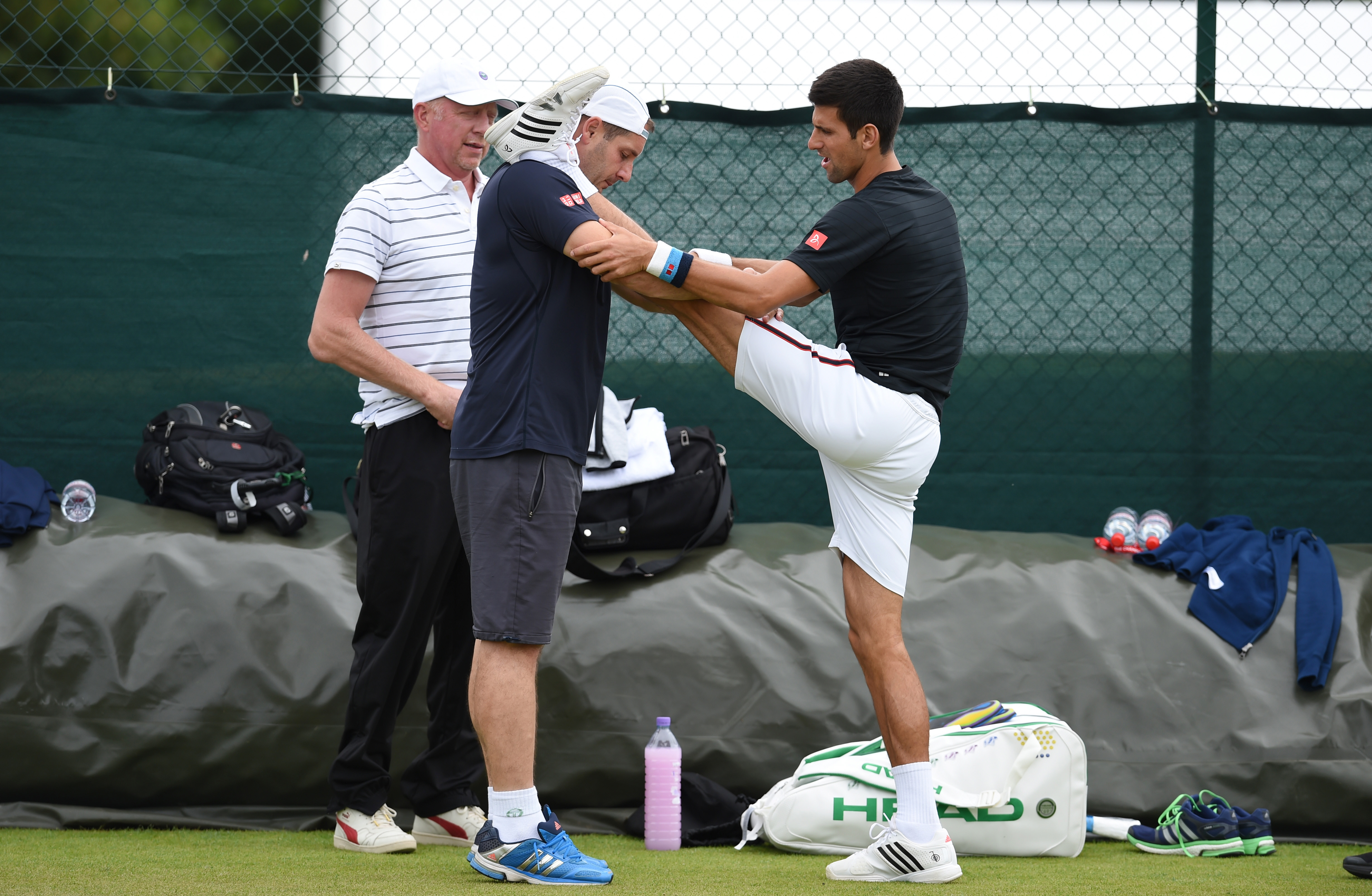 Novak Djokovic limbers up before a session on court. Photo: Reuters 