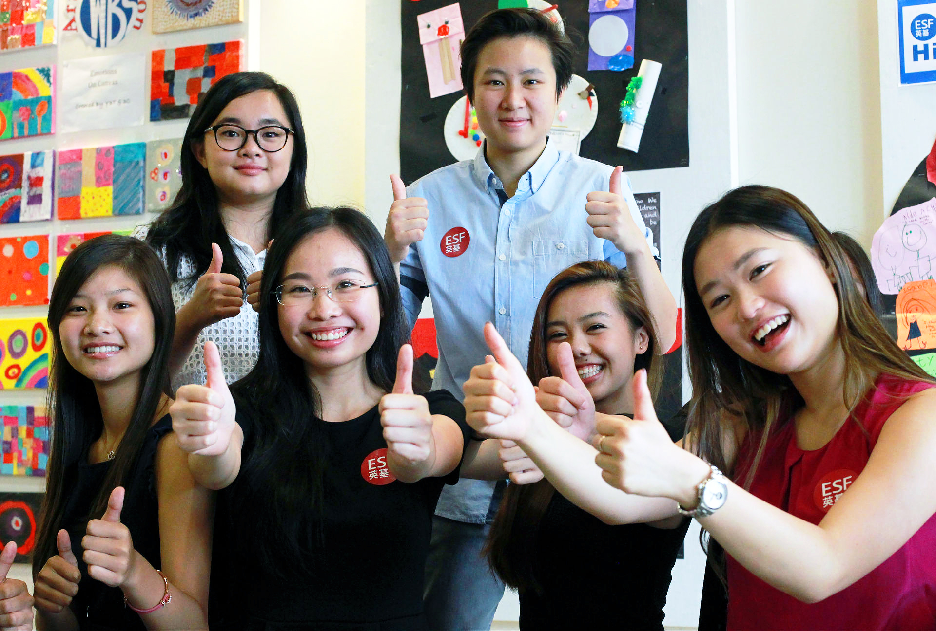 Thumbs up from some of the English Schools Foundation students who received a perfect International Baccalaureate score. Photo: May Tse