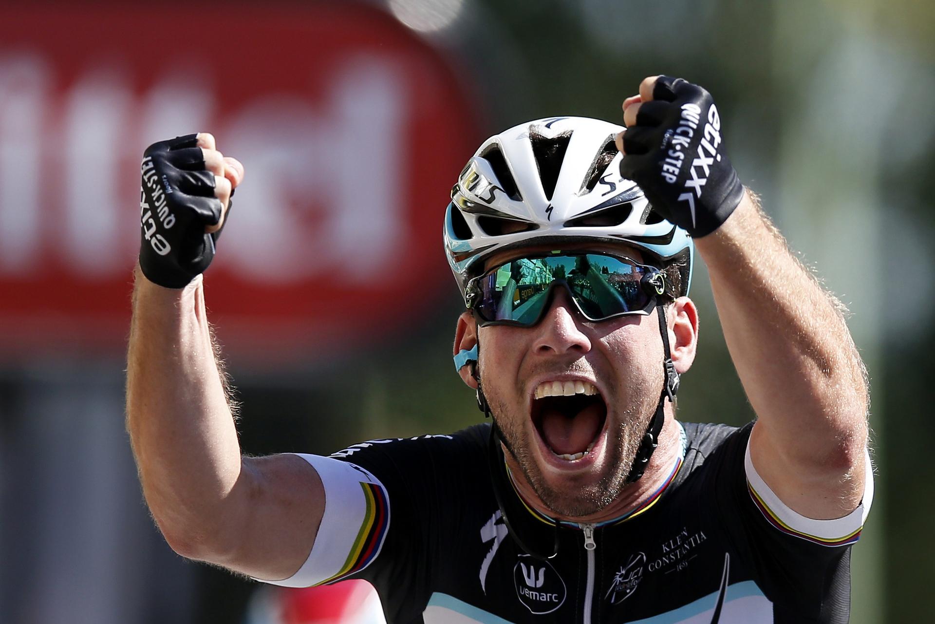 Mark Cavendish of Britain is over the moon as he crosses the finish line in Fougeres to win the seventh stage of the Tour de France. Photos: EPA