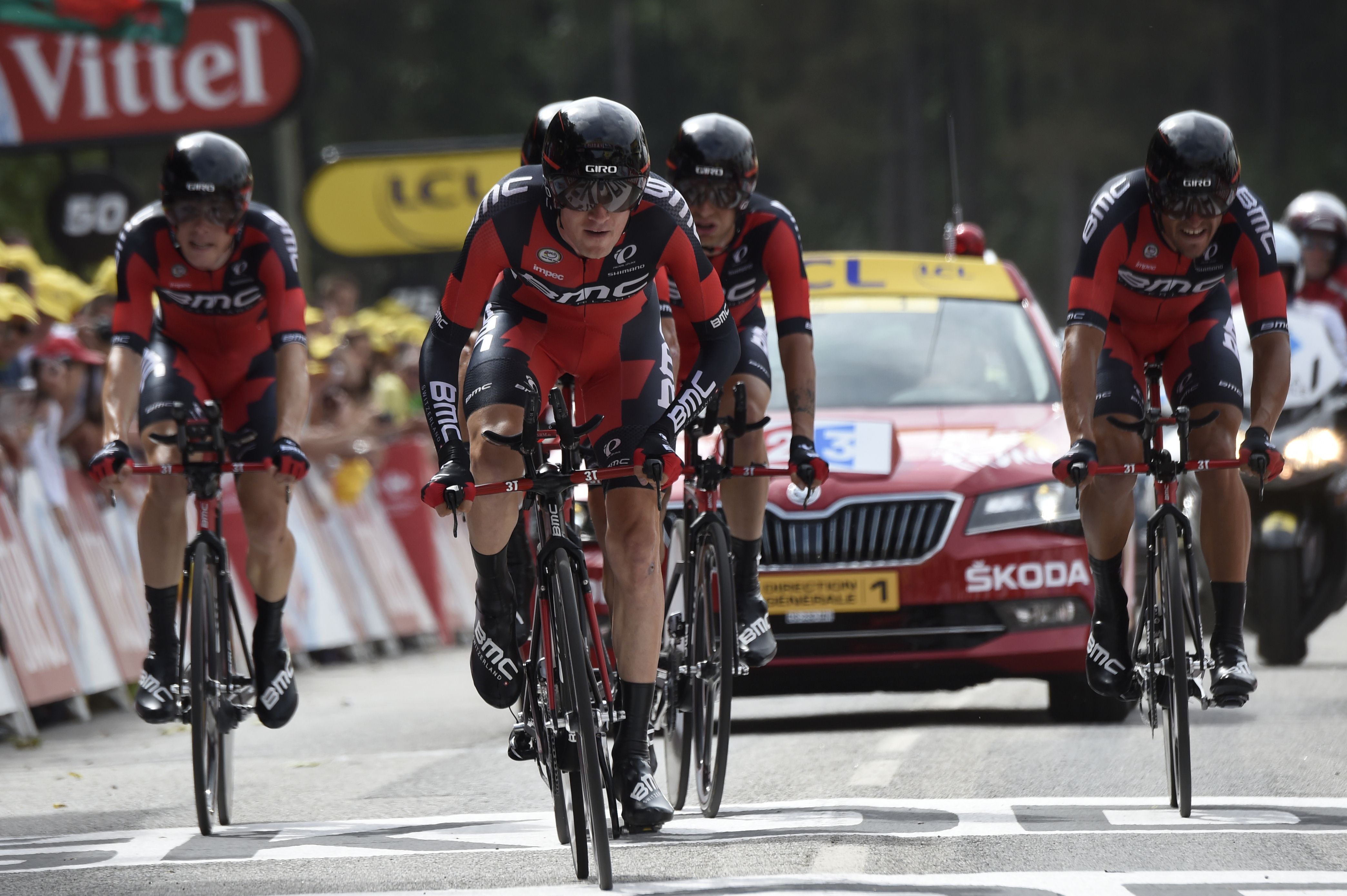 Riders of the USA's BMC Racing cycling team cross the finish line at the end of the 28 km team time-trial. Photo: AFP