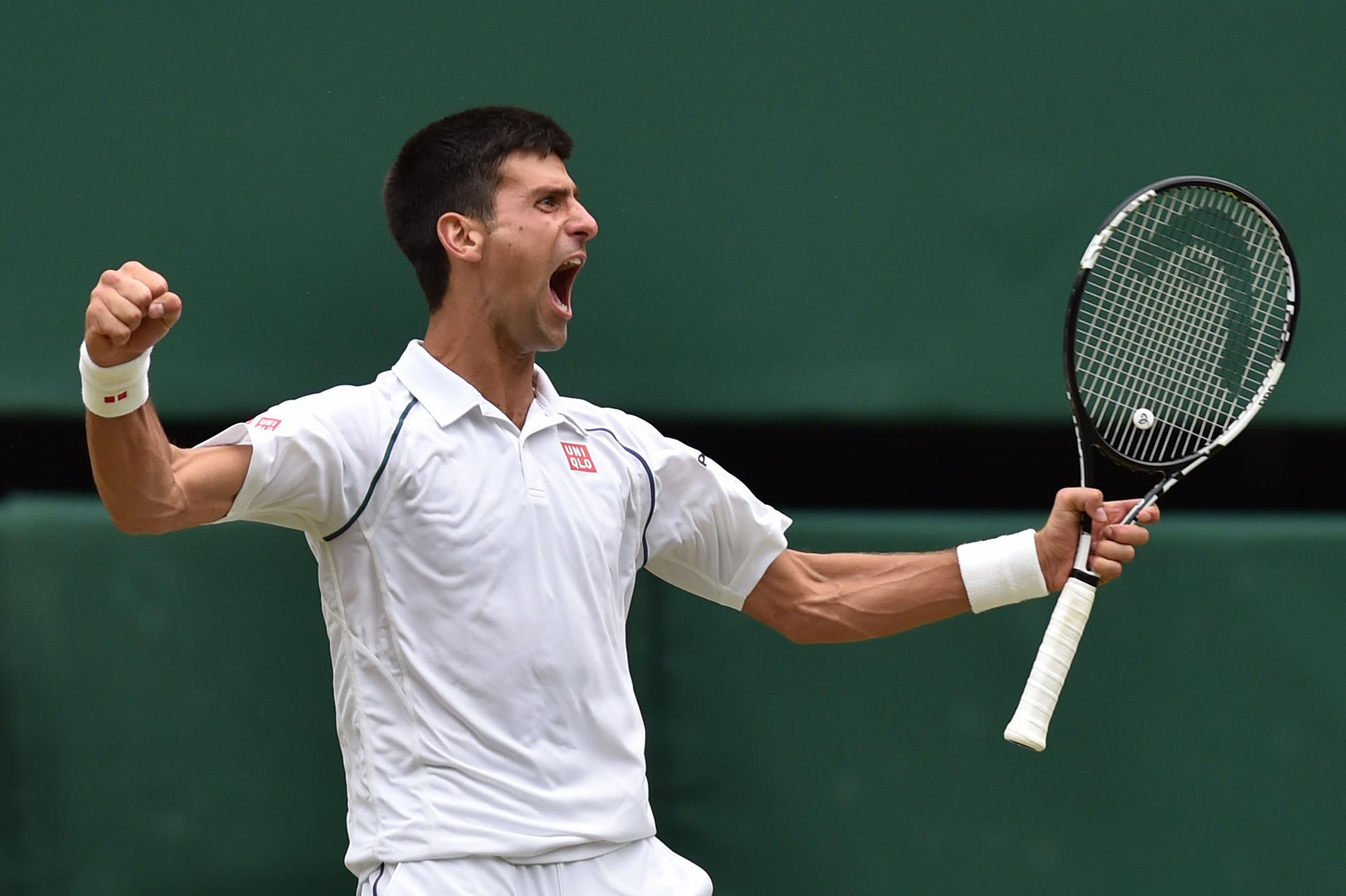 Serbia's Novak Djokovic lets out a celebratory yell after beating Roger Federer in the Wimbledon men's singles final for his third All England Club championship. Photo: AFP