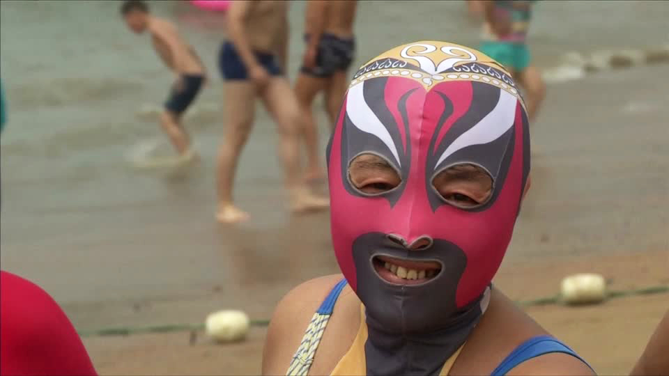 The face-kini mask is worn by many in China to protect them from the sun and jelly fish stings. Photo: Reuters