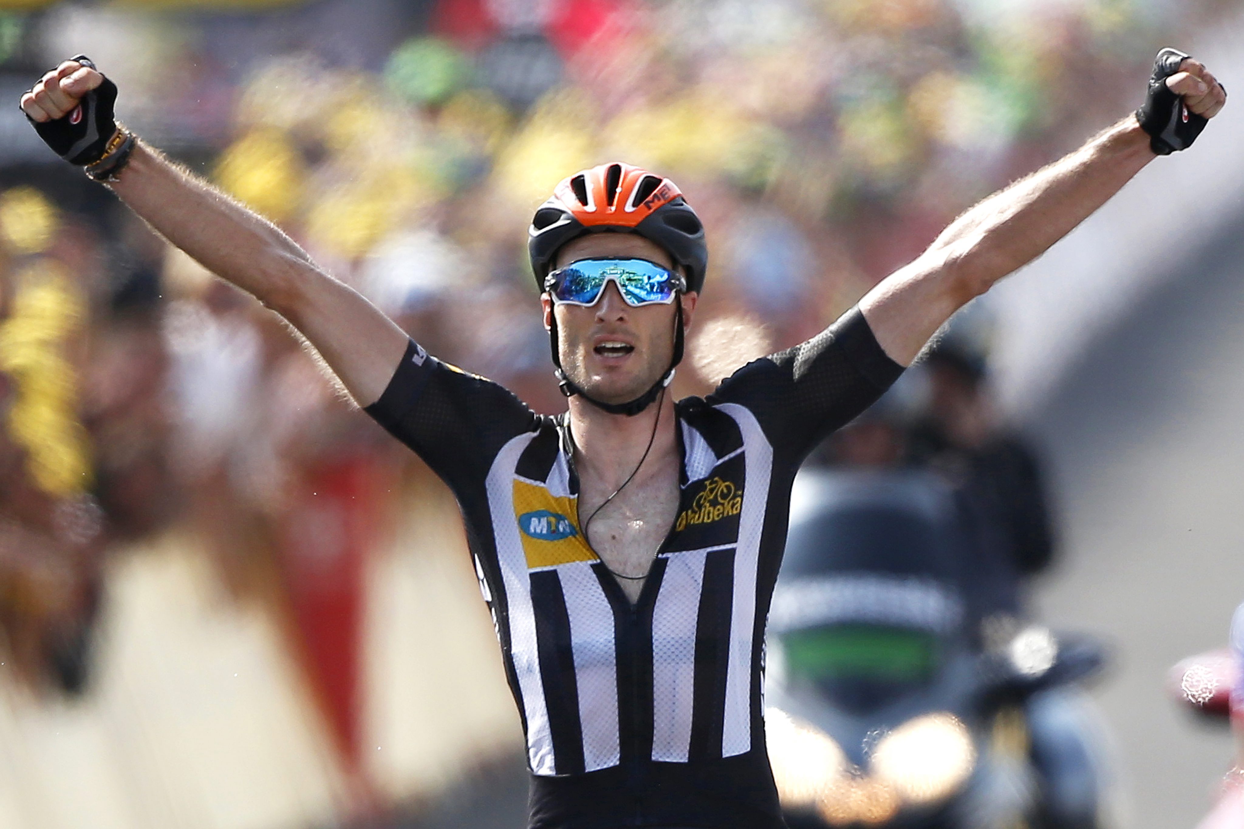 MTN-Qhubeka team rider Stephen Cummings celebrates as he wins the 14th stage of the Tour de France in Mende. Photo: EPA