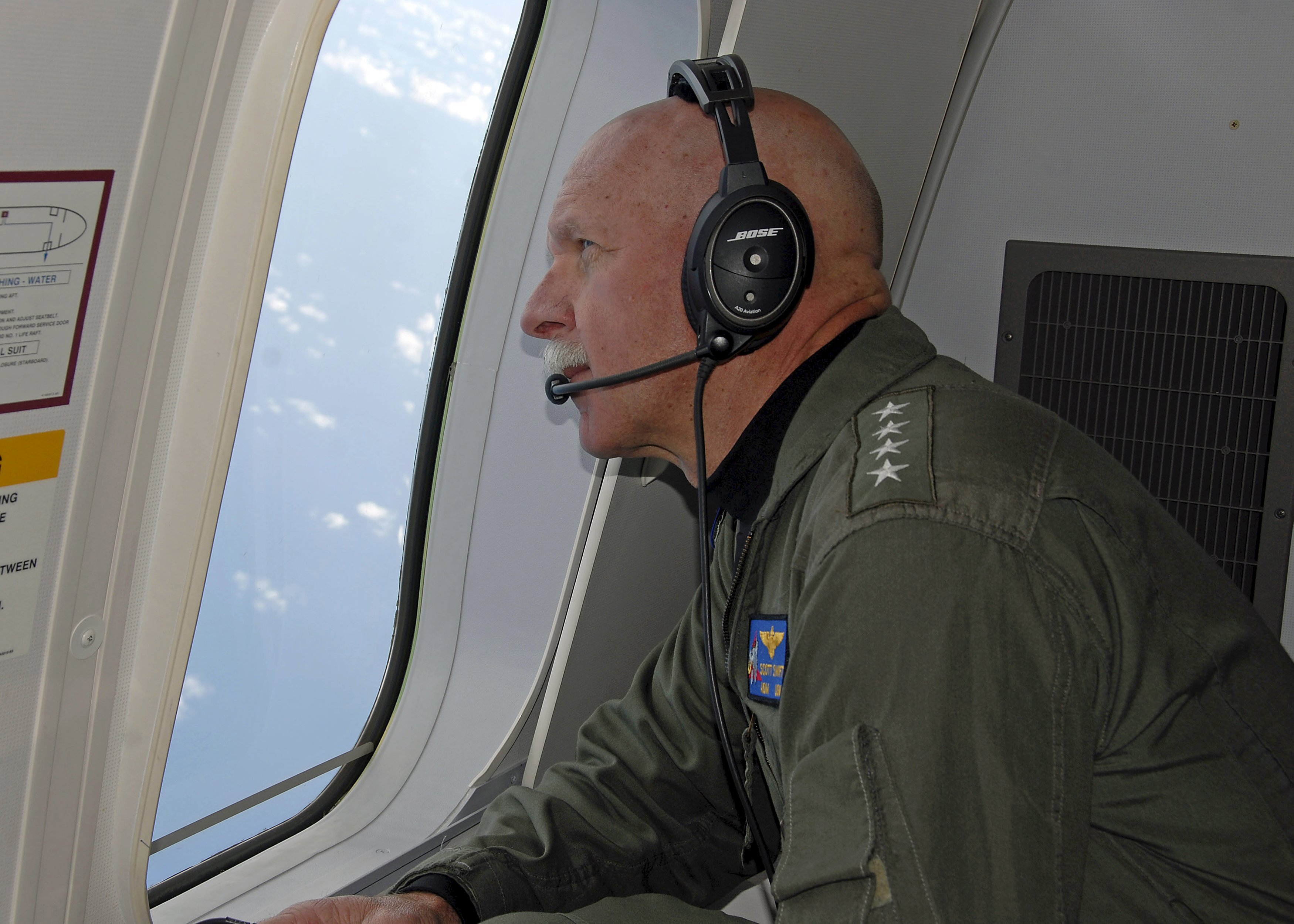 Adm. Scott Swift, commander of the U.S. Pacific Fleet, observes operations during a flight in the South China Sea last week. Photo: Reuters