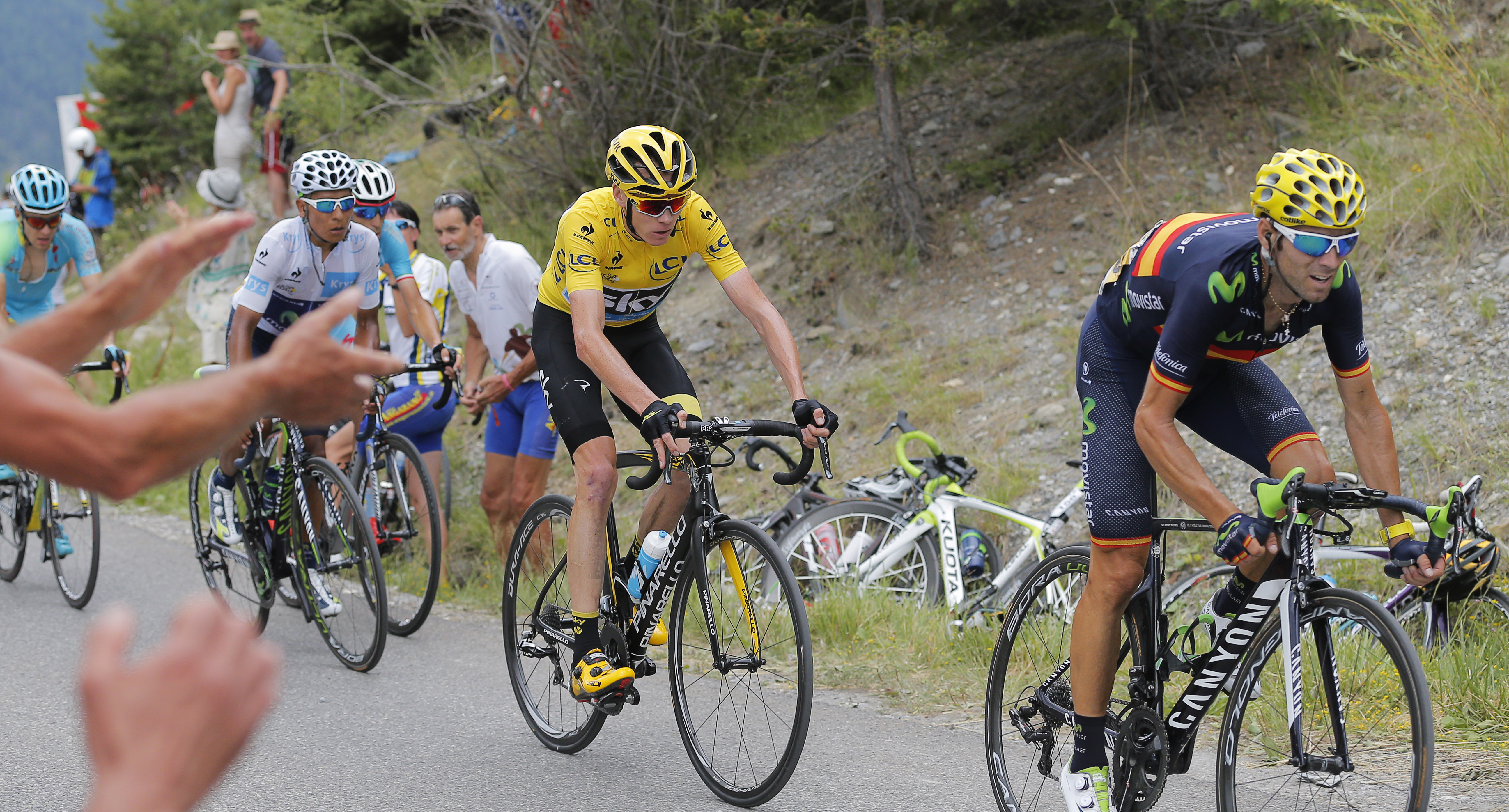 Spain's Alejandro Valverde, right, Britain's Chris Froome, wearing the overall leader's yellow jersey, and Colombia's Nairo Quintana, wearing the best young rider's white jersey, ride during the seventeenth stage. Photo: AP