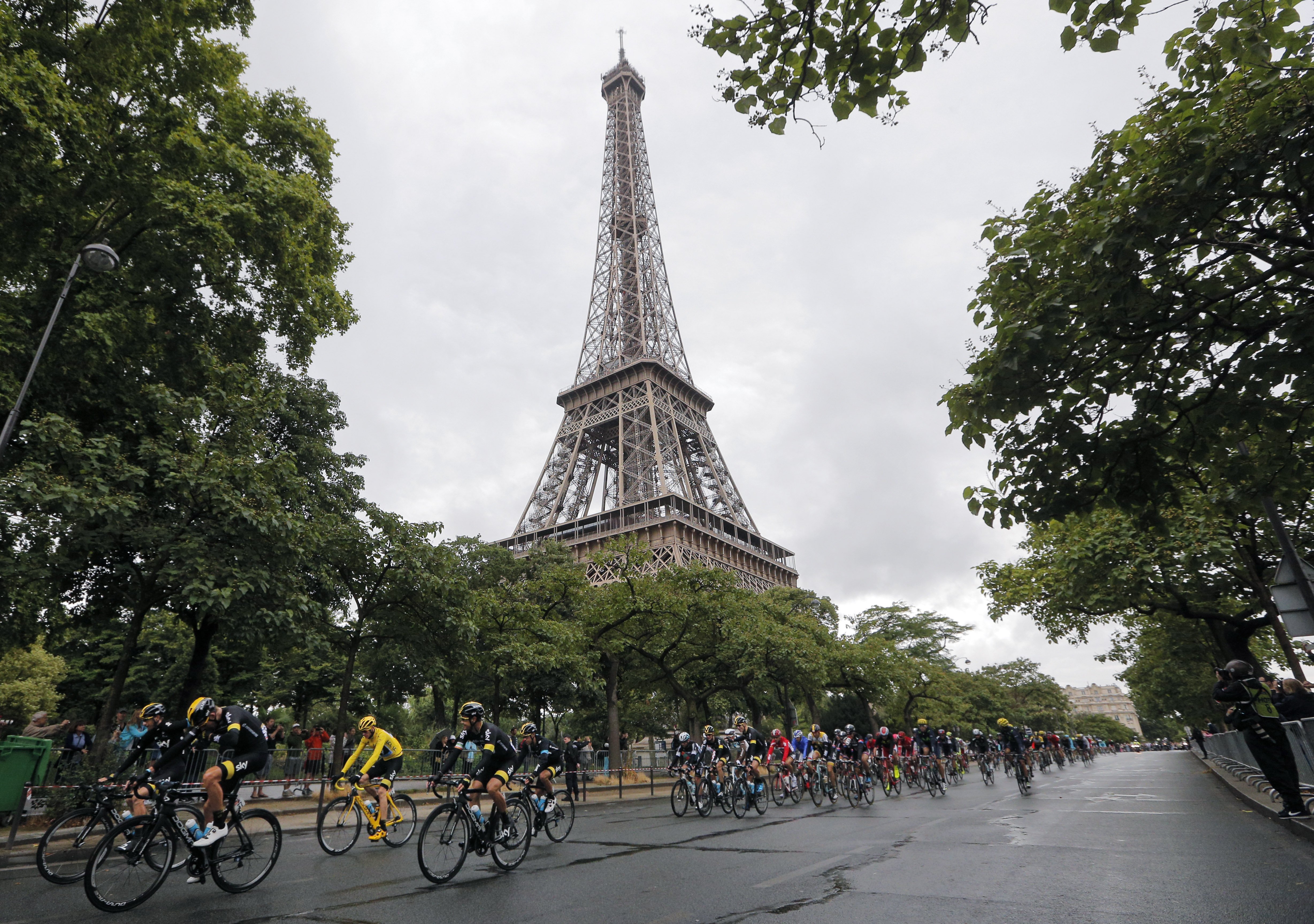 Chris Froome rides past the Eiffel Tower. Photo: AP