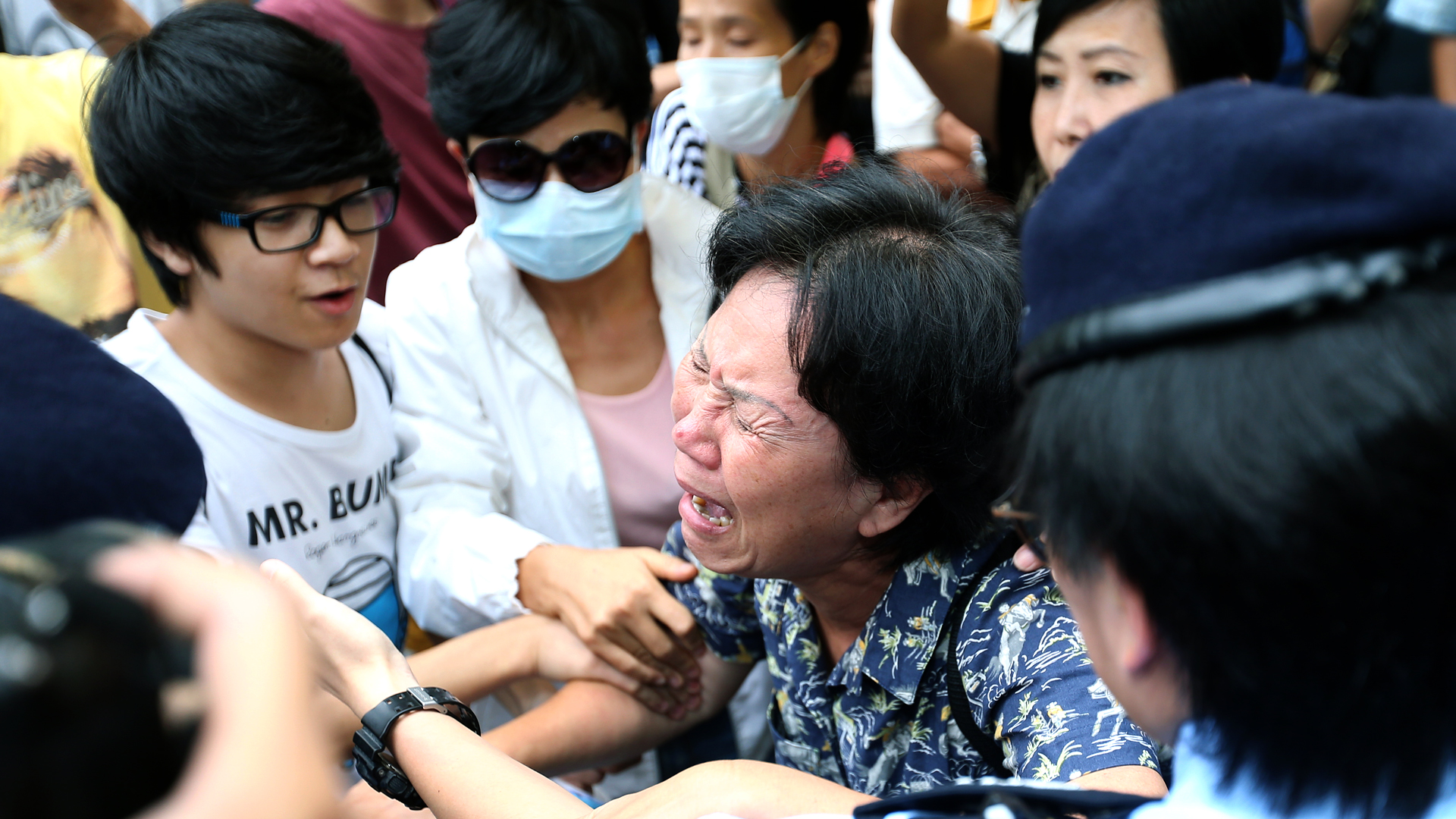 Breast is not a weapon,' Hong Kong protesters shout as they gather at  police headquarters