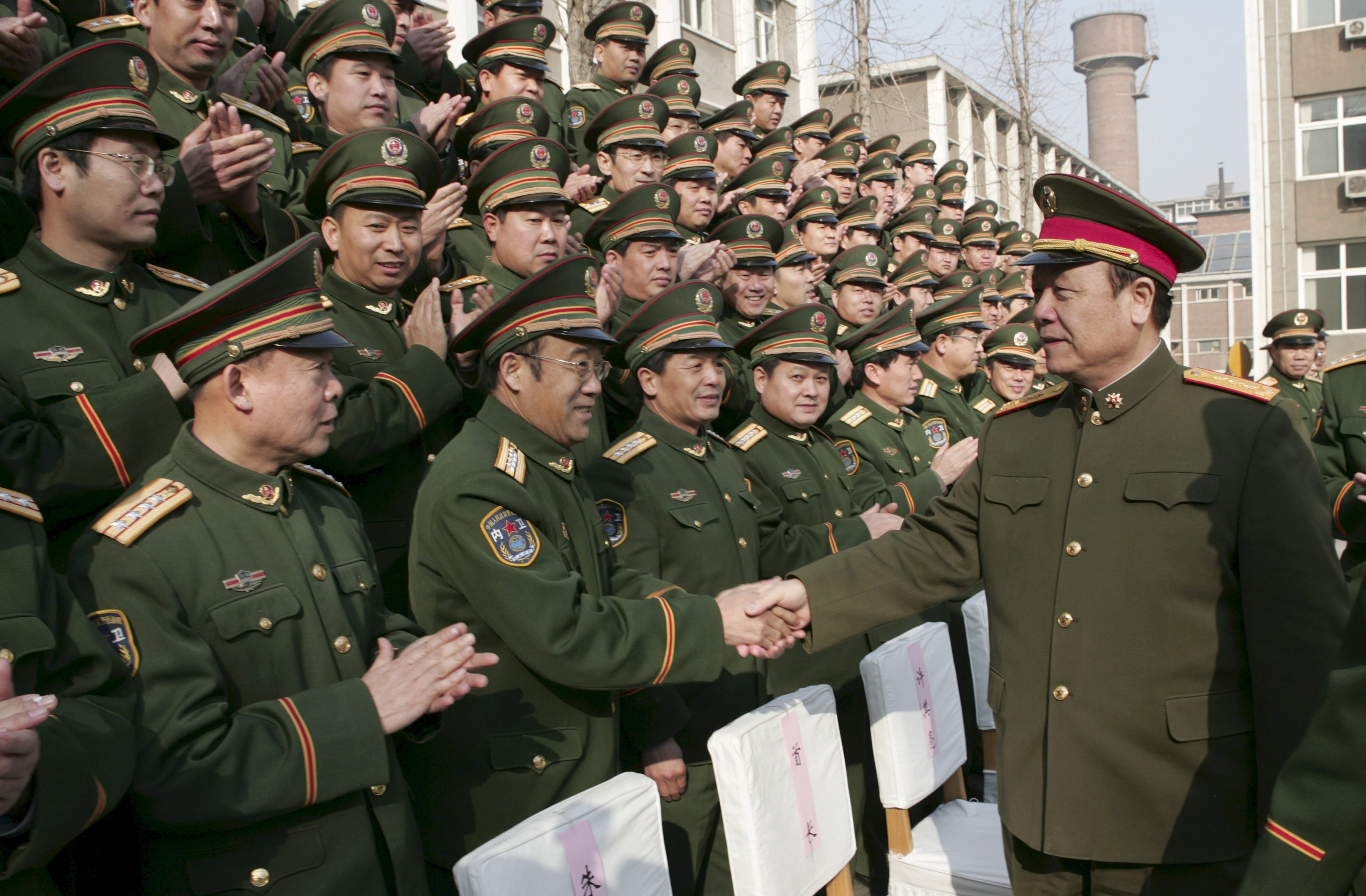 Guo, right, meeting troops during his term as one of the top leaders in the PLA. Photo: Reuters