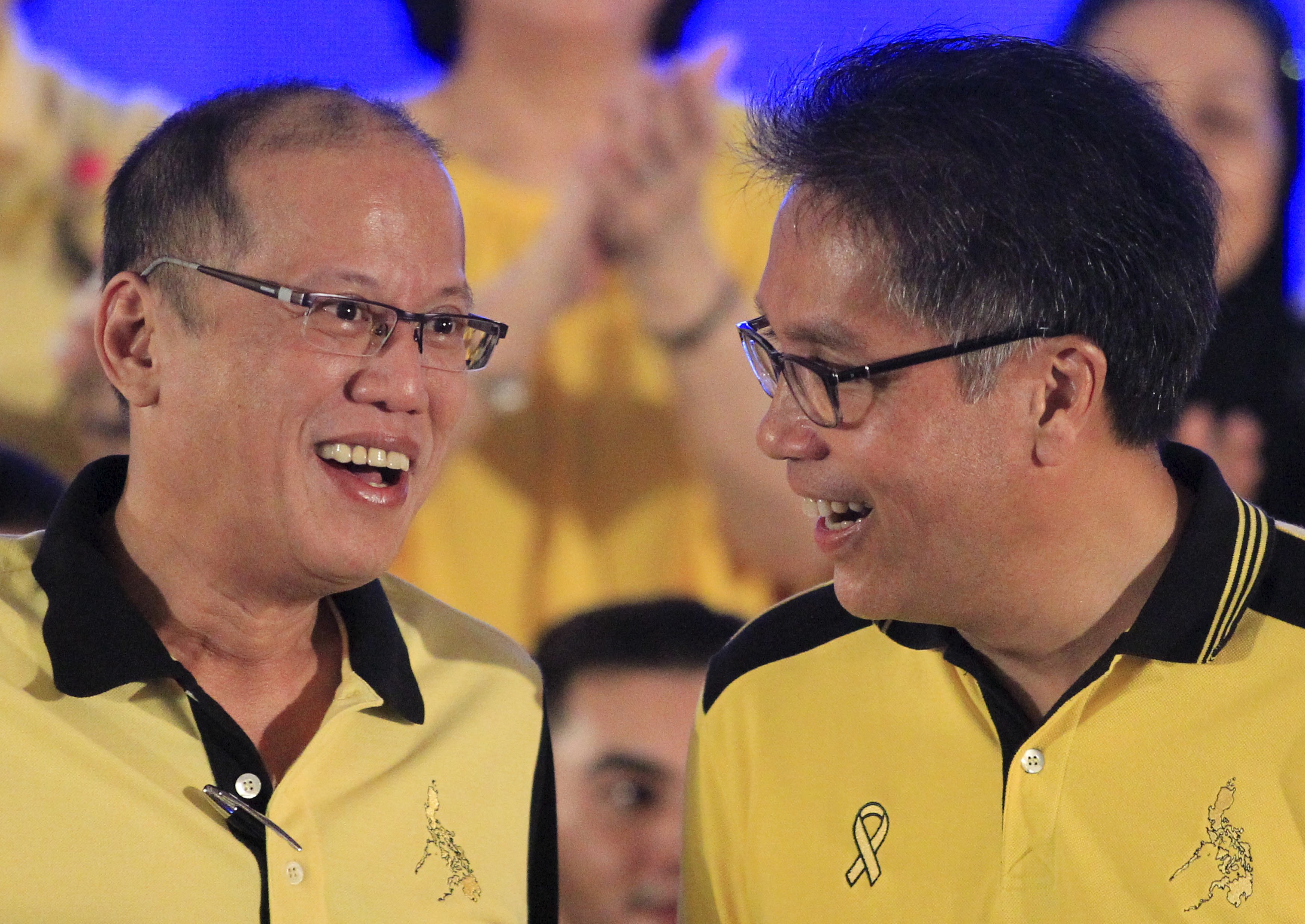 President Benigno Aquino (left) shares a light moment with Interior Secretary Manuel "Mar" Roxas. Photo: Reuters