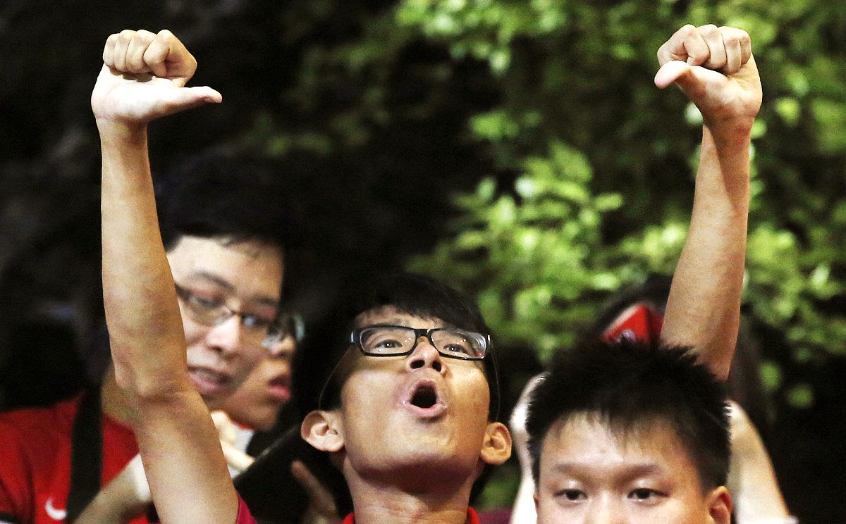A Hong Kong fan boos before the Maldives game. Photo AP