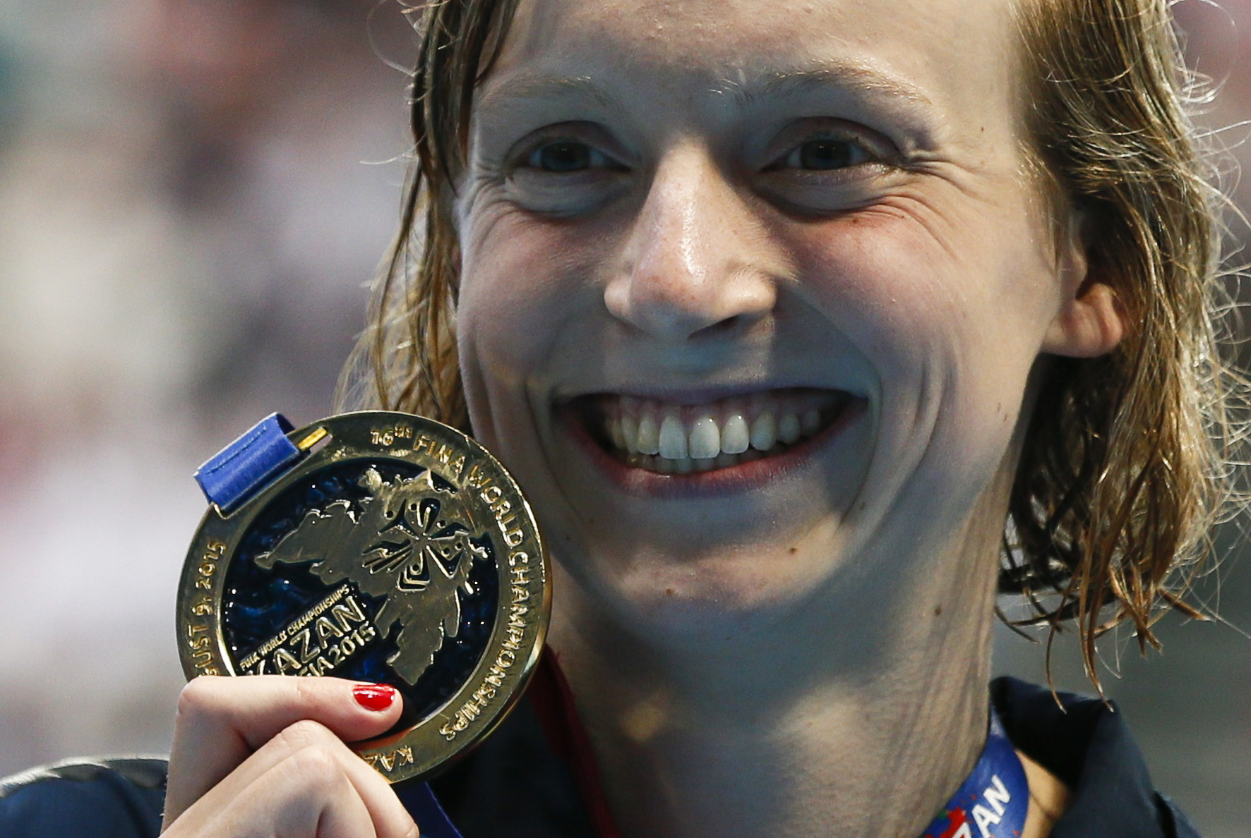Katie Ledecky is all smiles after receiving her gold medal after the women's 200m freestyle final. Photo: Reuters 