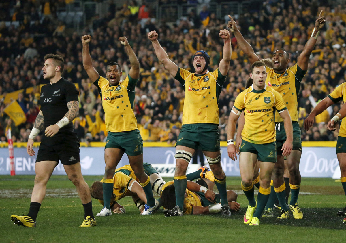 Australia celebrate beating New Zealand in Sydney on Saturday to capture the 2015 Rugby Championship and take the first of their two Bledisloe Cup games. Photo: Reuters