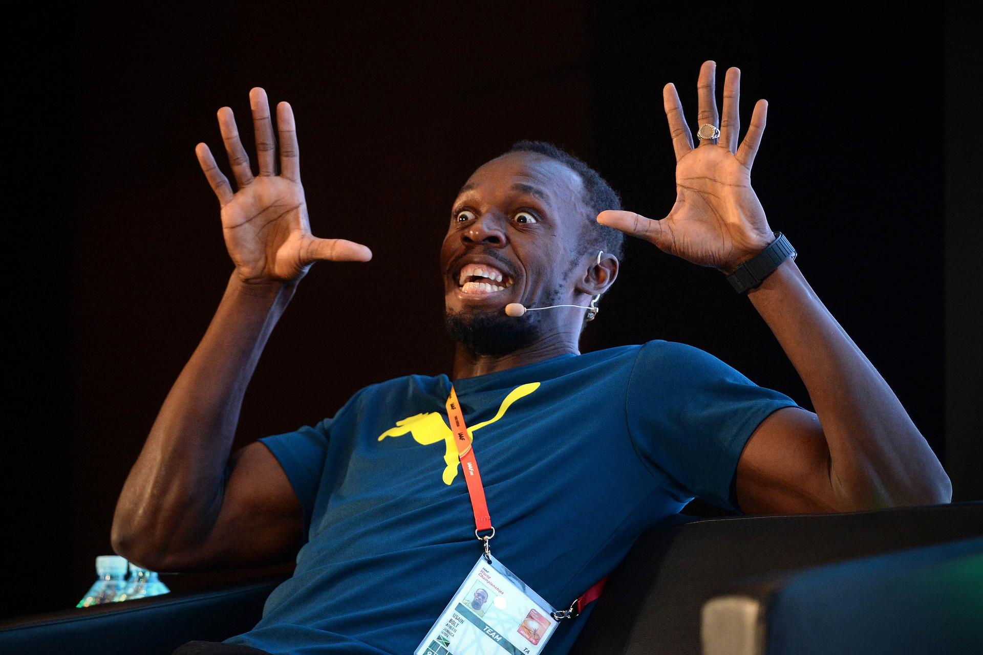 Jamaican sprint superstar Usain Bolts strikes a funny pose at a press conference ahead of the World Championships in Beijing. Photos: AFP