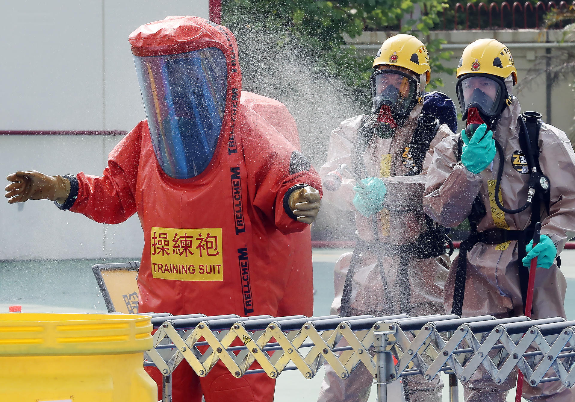 Hazmat team members in Sha Tin yesterday demonstrate how hazardous material incidents are handled.Photo: Edward Wong