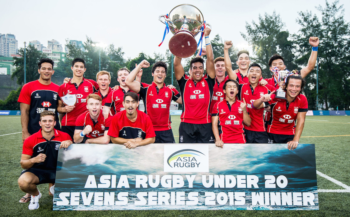 Skipper Richard Lewis hoists the silverware as Hong Kong celebrate winning their second successive Asia Rugby U20 Sevens Series title on Saturday at King's Park. Photos: HKRU