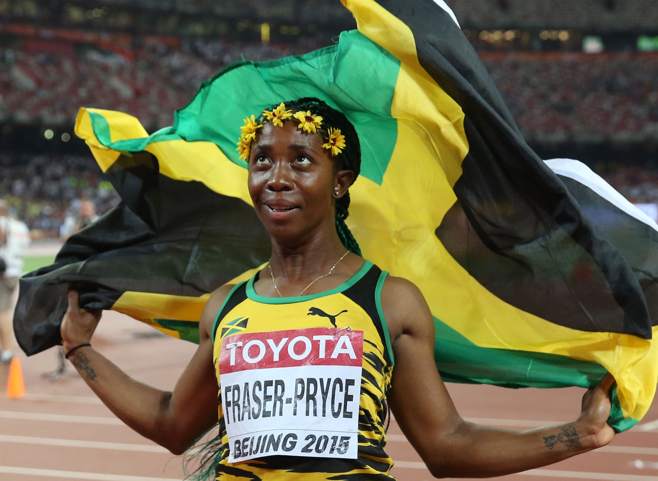 Jamaica's Shelly-Ann Fraser-Pryce celebrates after winning the women's 100 metres at the World Athletics Championships in Beijing. Photo: Xinhua