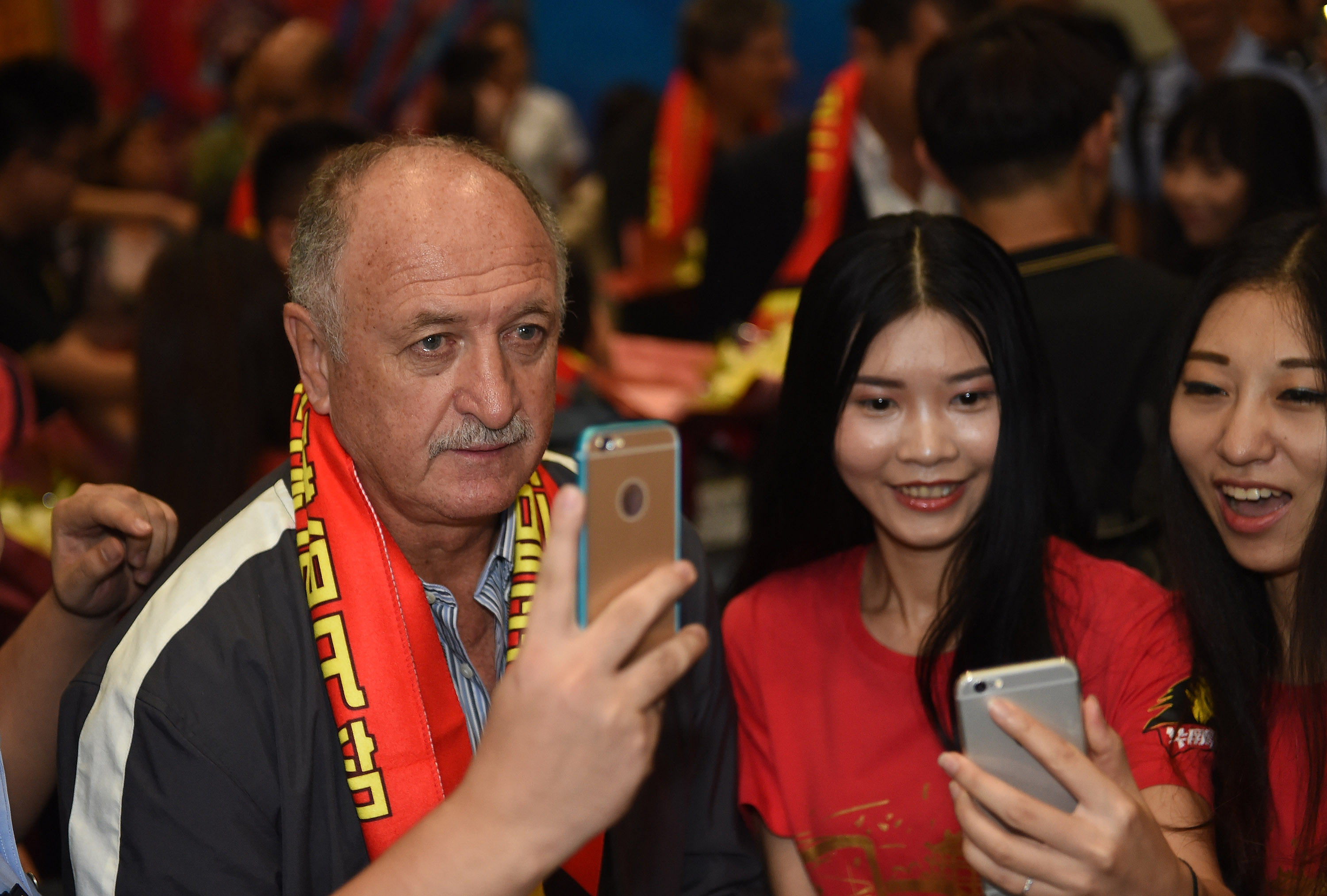 Flashback to June when Luiz Felipe Scolari joined supporters for selfies after arriving to take charge of Guangzhou Evergrande. Photo: Xinhua