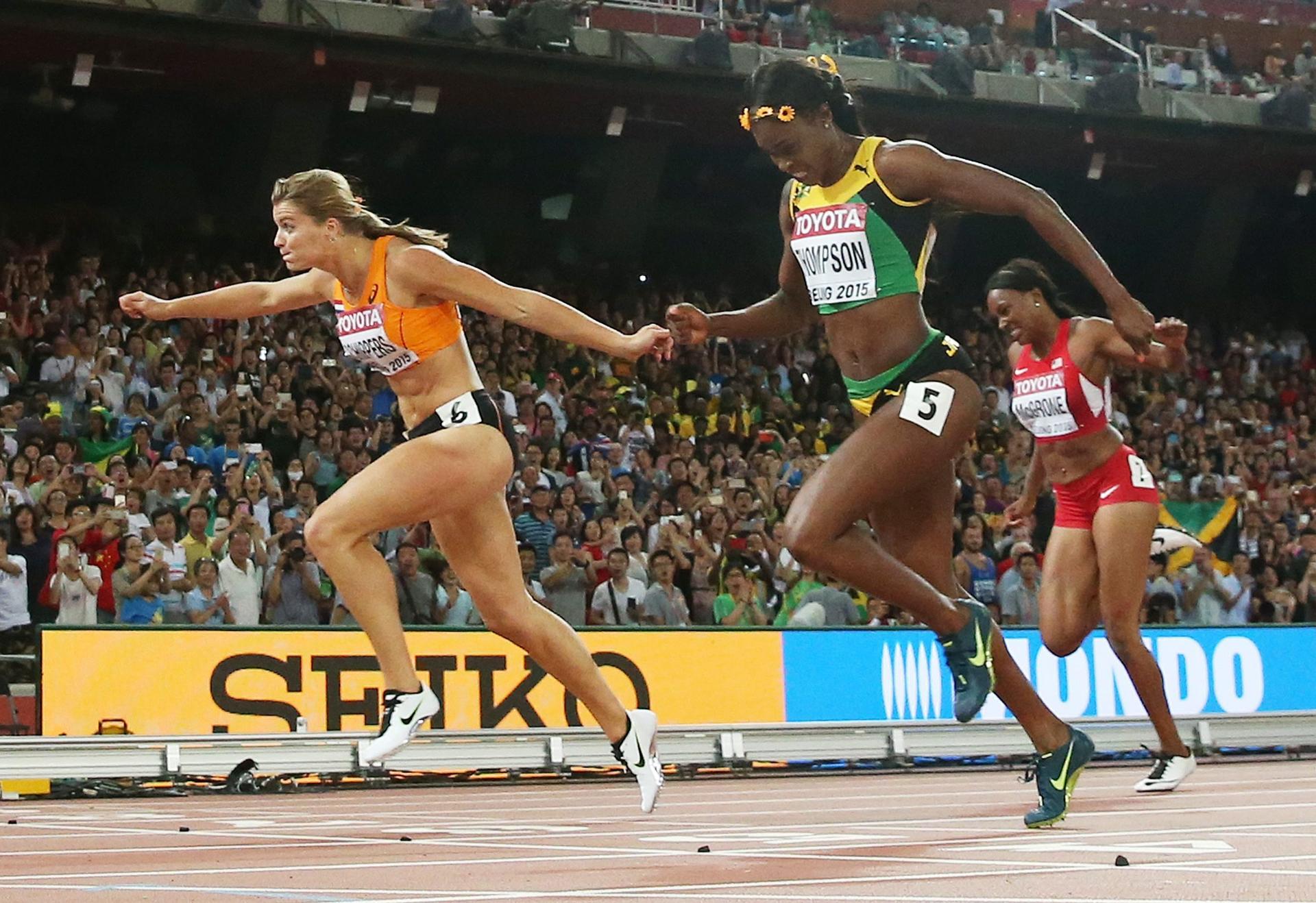 Dafne Schippers wins the 200m final to deny Jamaican Elaine Thompson gold, becoming the third fastest in history. Photo: EPA