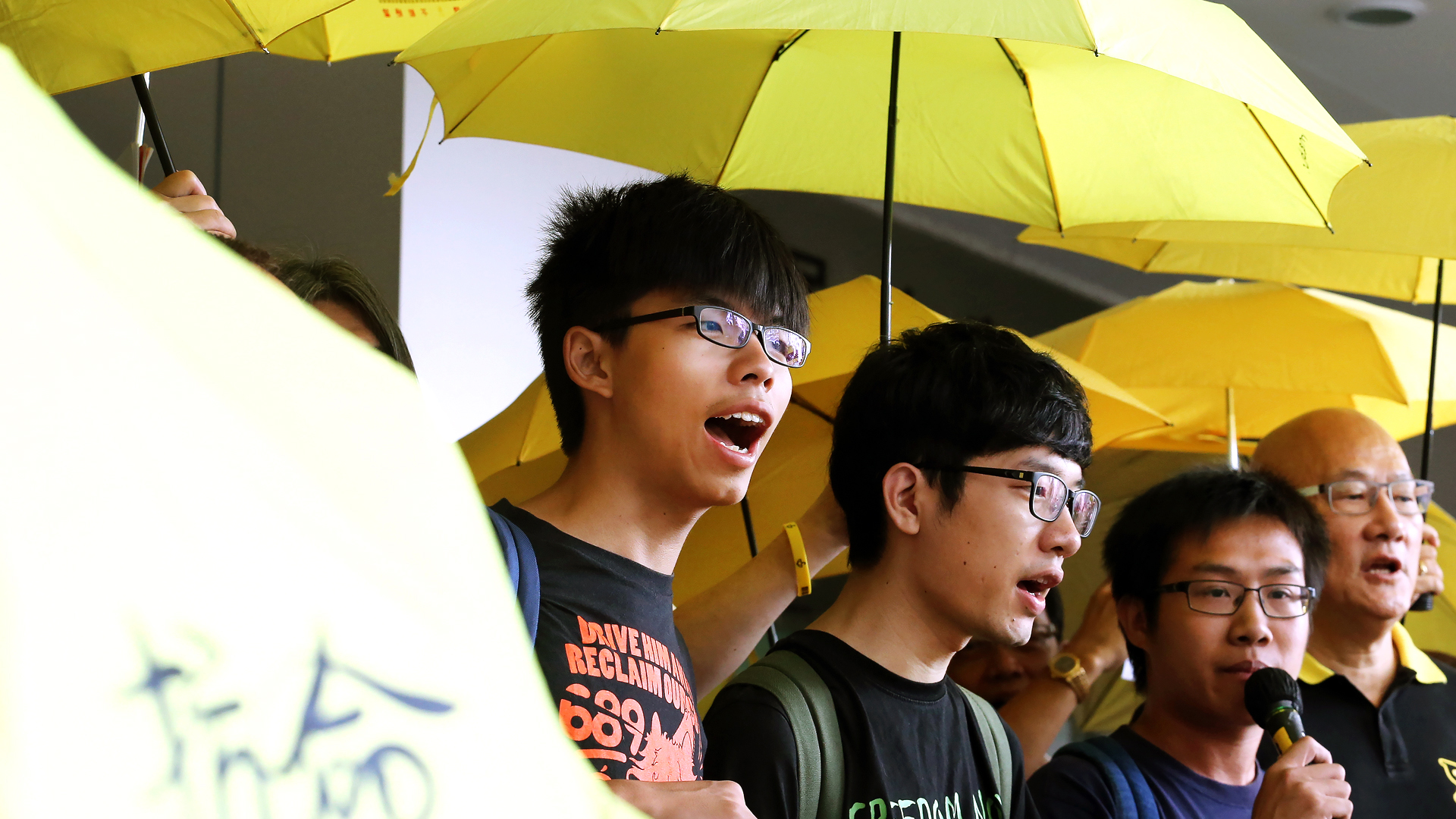 The four defendants (from left) Joshua Wong, Nathan Law, Raphael Wong and Albert Chan outside court before the hearing. Photo: Felix Wong