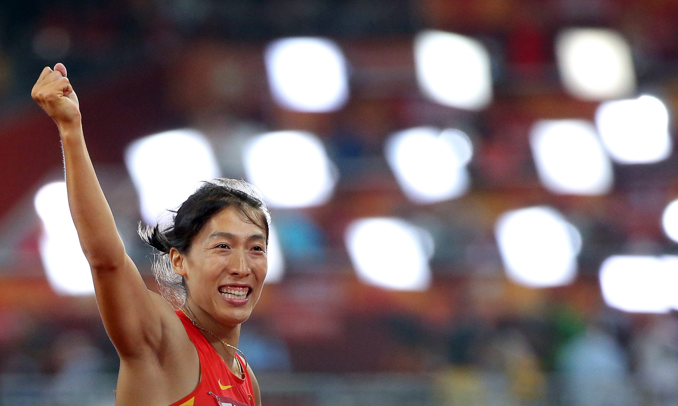 Lyu Huihui celebrates her javelin medal. Photo: EPA