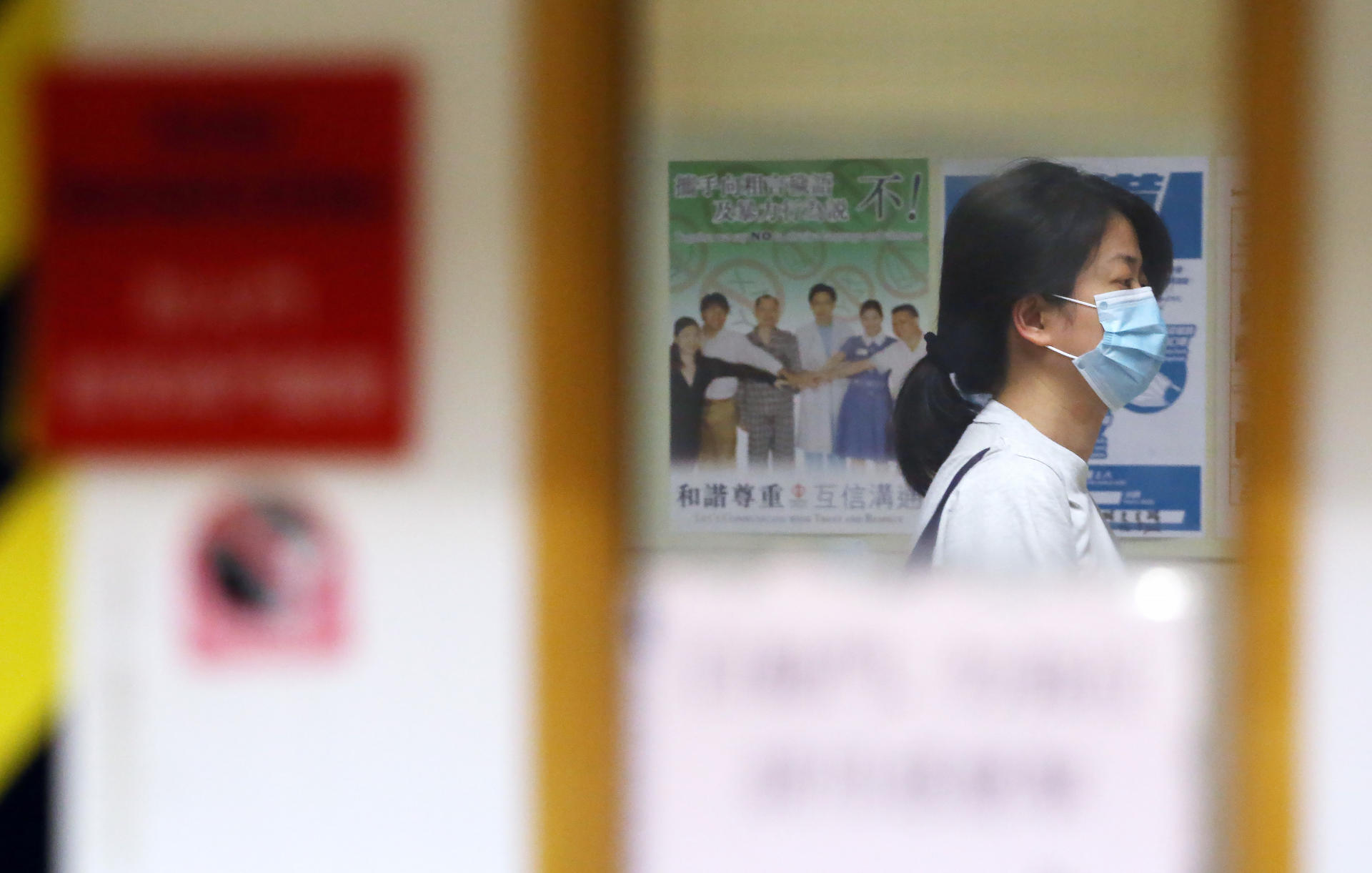 The wife of the liver patient waits at the Queen Mary Hospital.Photo: Felix Wong
